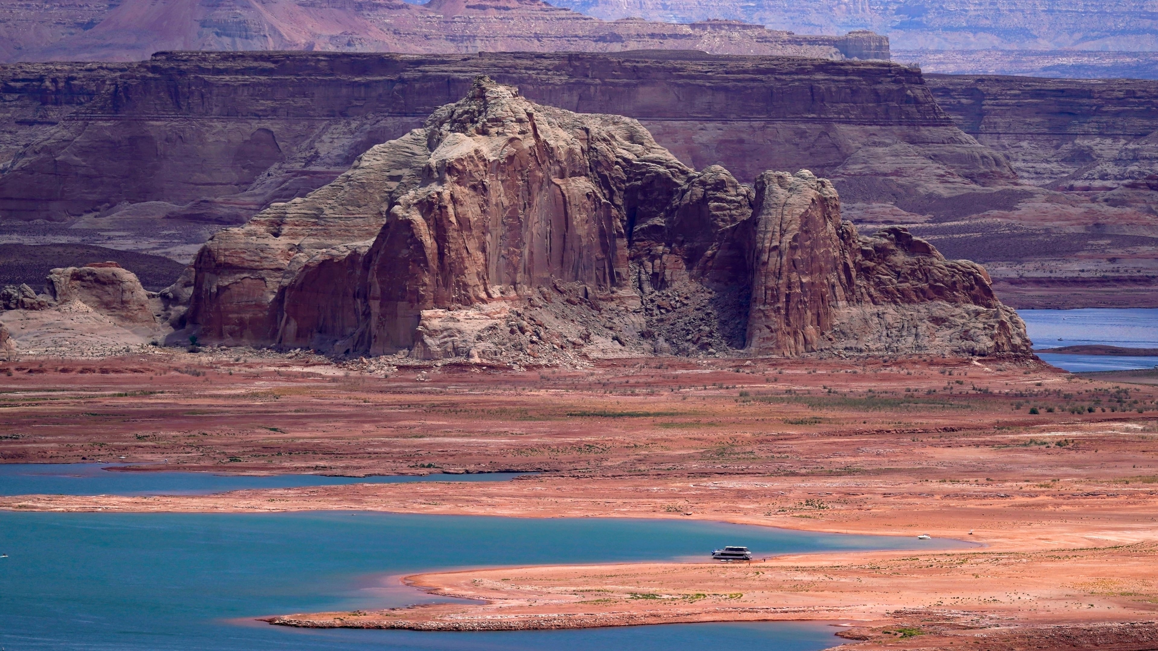 FILE - Low water levels at Wahweap Bay at Lake Powell, along the Upper Colorado River Basin are shown, June 9, 2021, at the Utah and Arizona border at Wahweap, Ariz. (AP Photo/Ross D. Franklin, File)