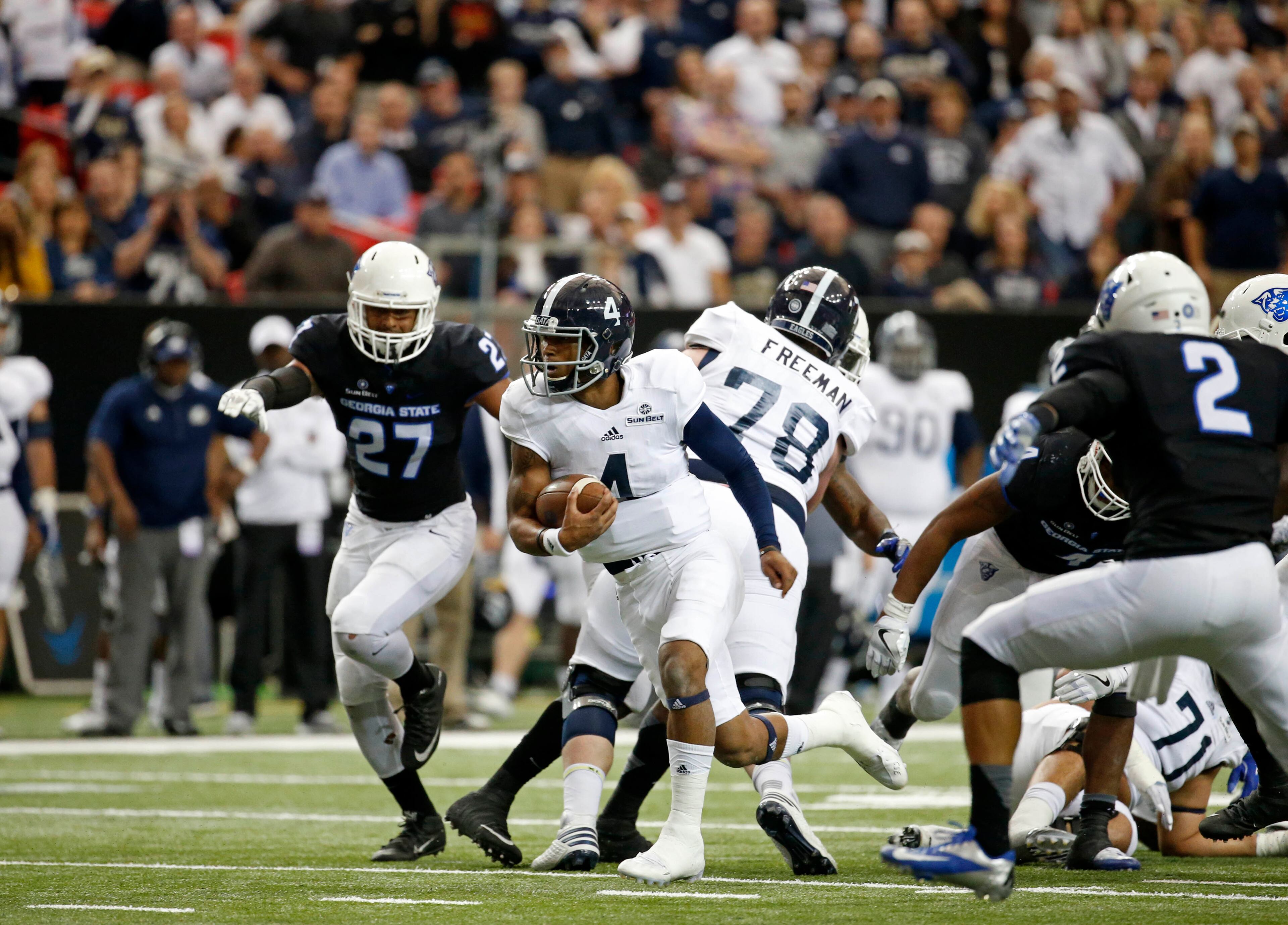November 19, 2016 - Atlanta, Ga: Georgia Southern Eagles quarterback Kevin Ellison (4) scores a touchdown against the Georgia State Panthers during the first half at the Georgia Dome Saturday November 19, 2016, in Atlanta, Ga. PHOTO / JASON GETZ