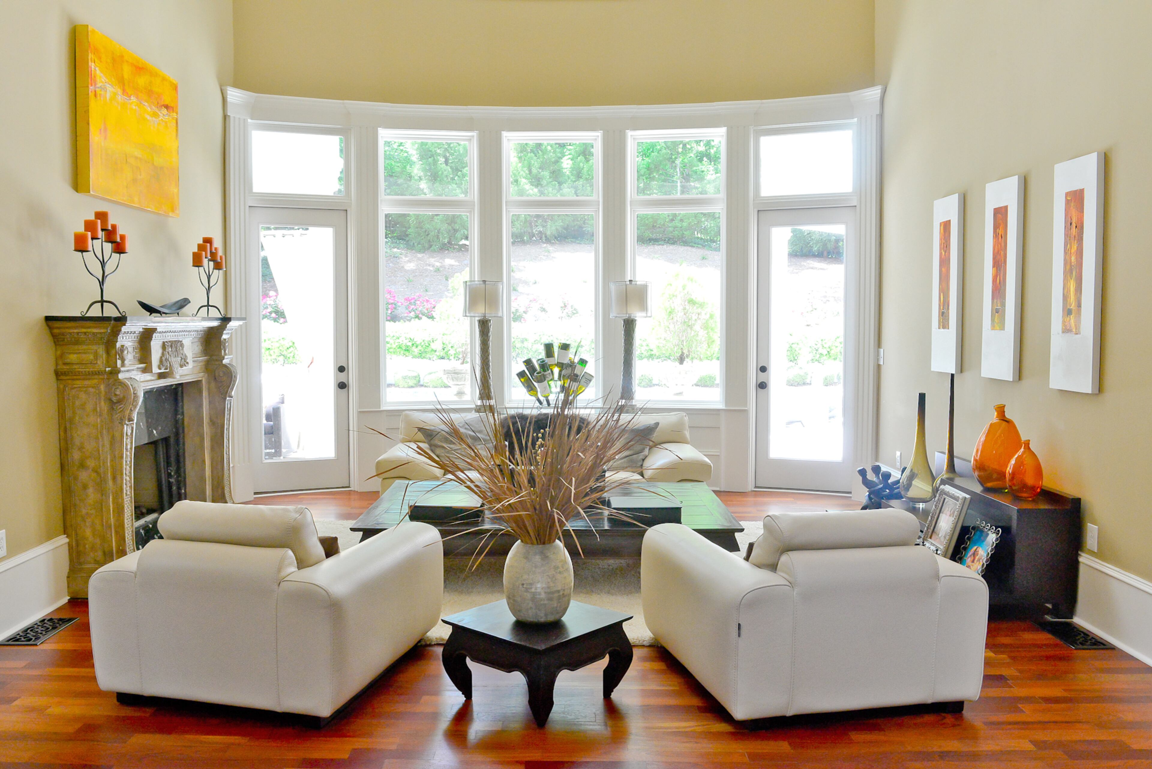 When Jeffrey Bulvin moved into his 7,100-square-foot Mediterranean-style home in Vinings, he brought a "modern Old World" style to the space. In the living room, the wall color complements both the rich, Italianate fireplace and the modern furniture from Roche Bobois.