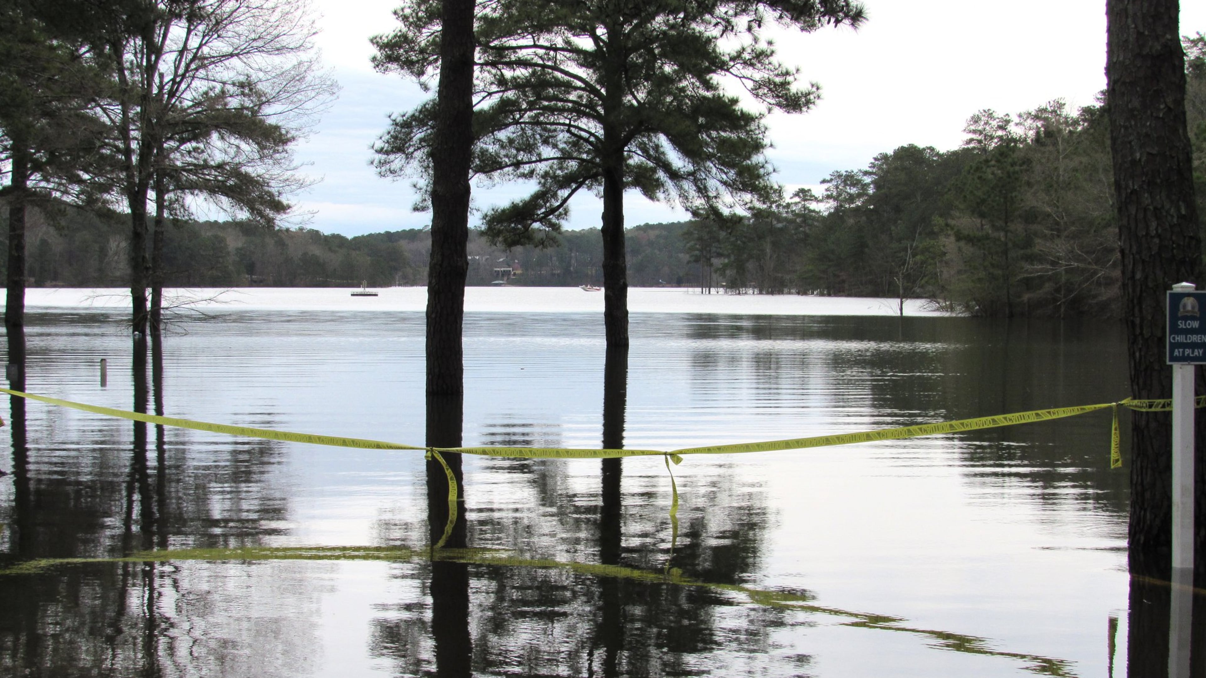 Recent rains have lake levels on the rise, leaving some picnic areas, playgrounds, parking lots and boat ramps submerged. These photos show conditions at Lake Allatoona and Lake Acworth, which feeds into it. Photos: Jennifer Brett, jbrett@ajc.com