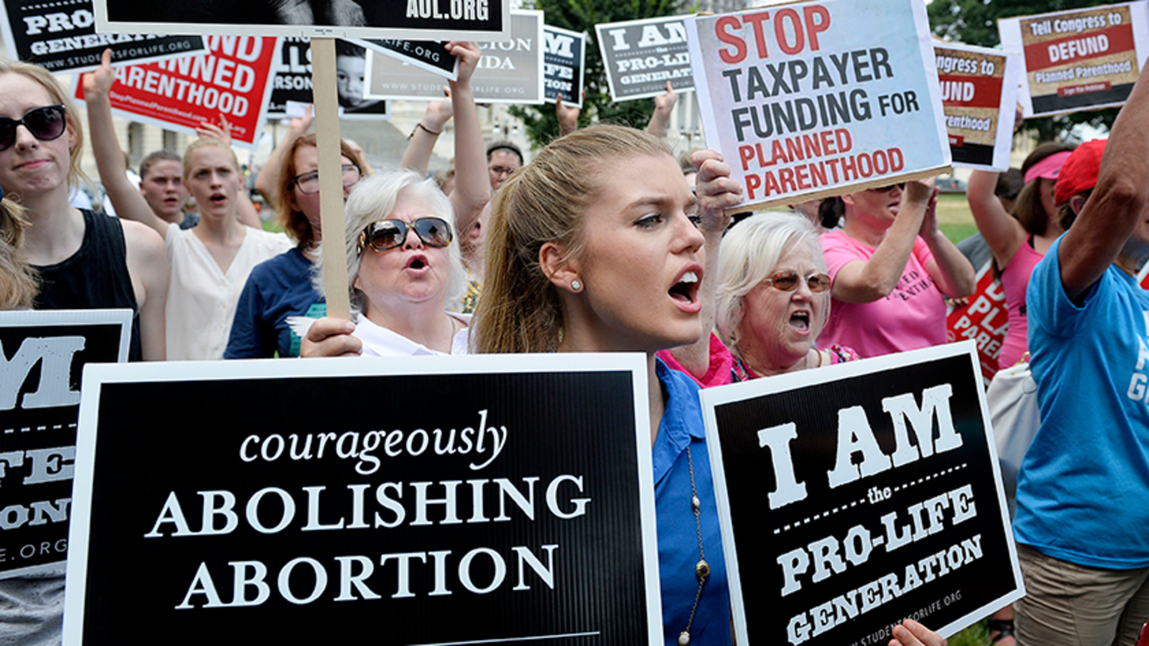 Anti-abortion activists rally against federal funding for Planned Parenthood in front of the U.S. Capitol on July 28. (Photo by Olivier Douliery/Getty Images)