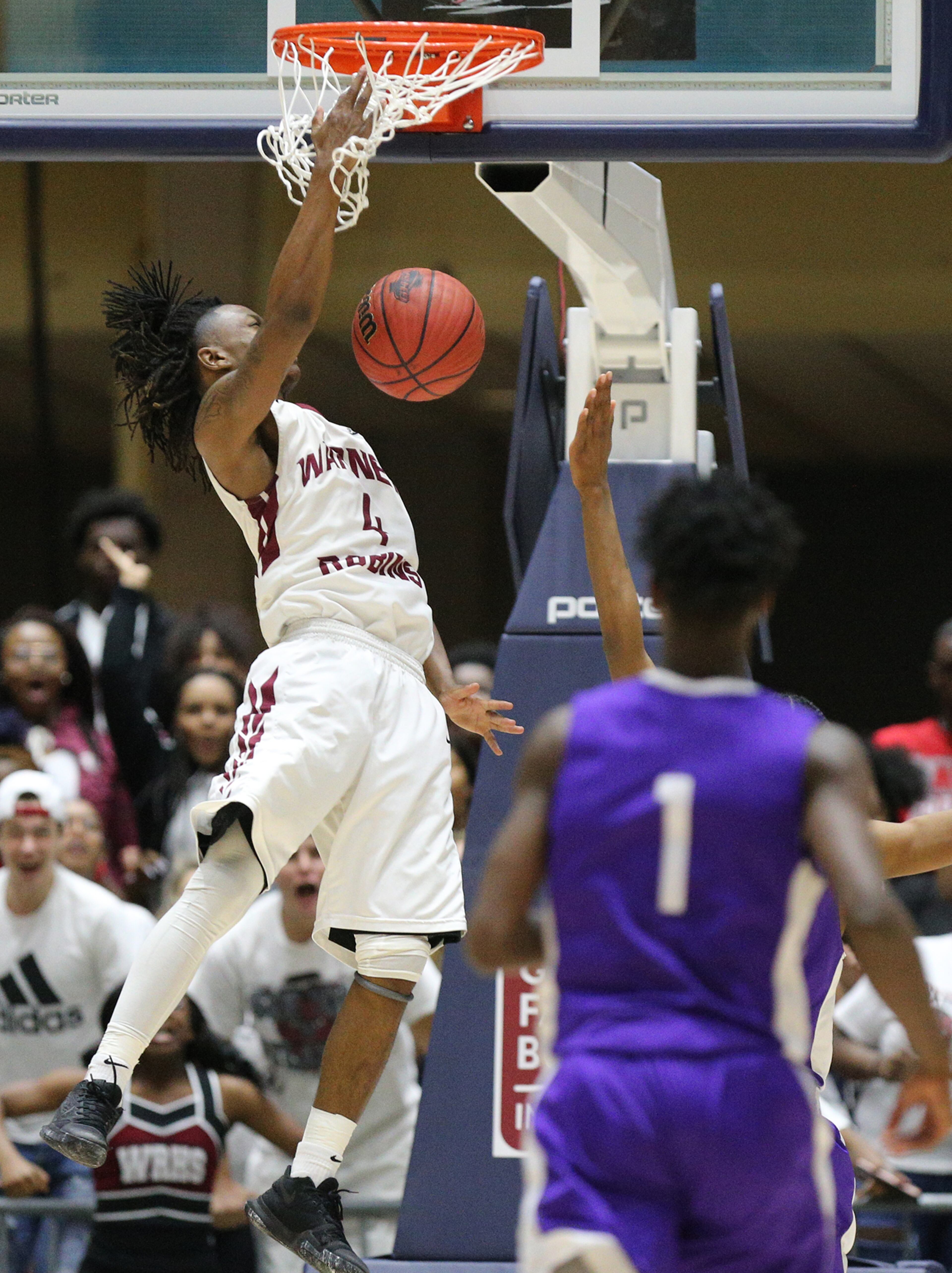 March 8, 2018 Macon: Warner Robins guard Jacolbey Owen slams for two against Miller Grove in their GHSA state basketball championship game on Thursday, March 8, 2018, in Macon. Curtis Compton/ccompton@ajc.com