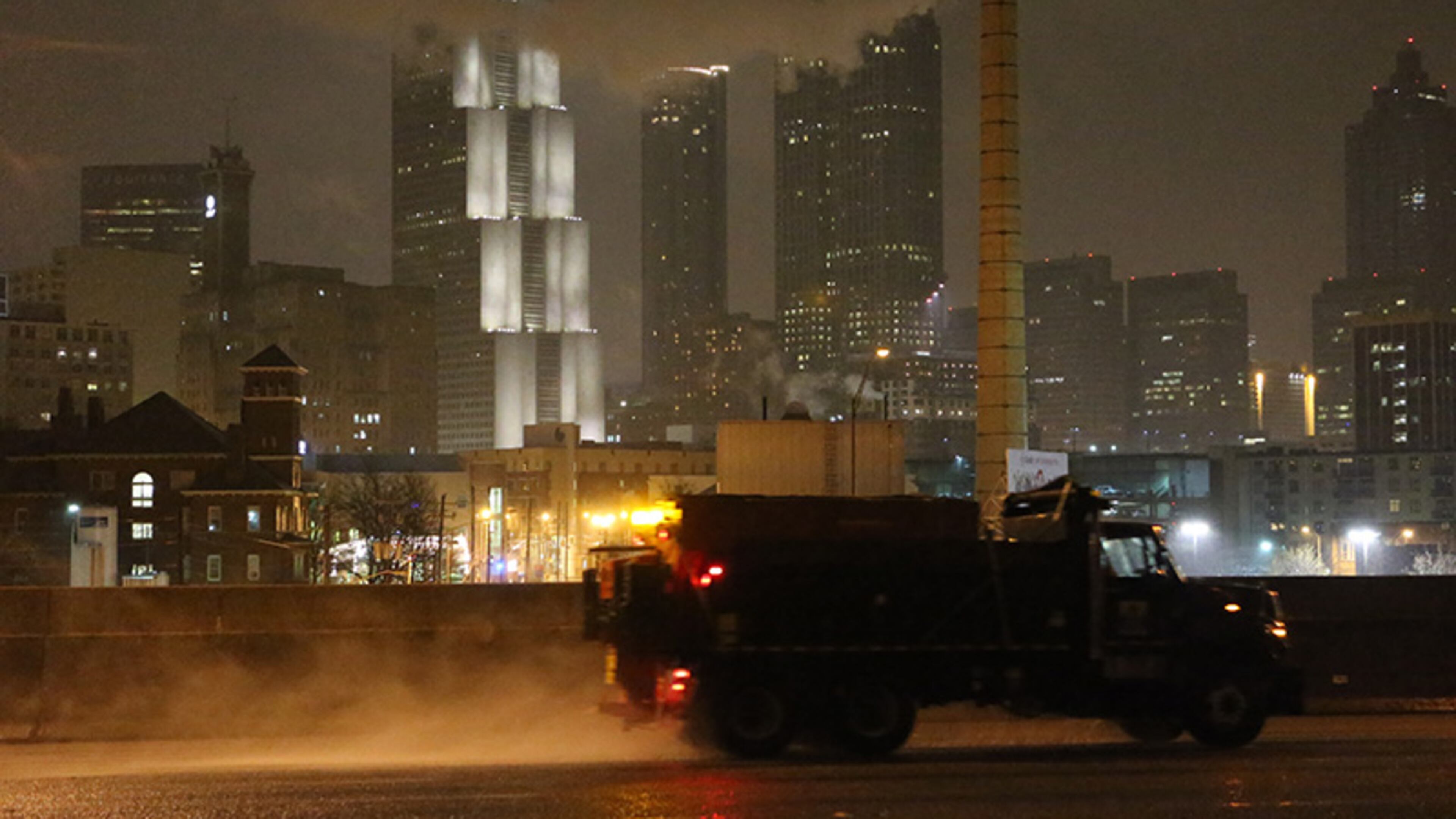 Crews were out treating the highways early Wednesday as an ice and snow storm began to coat the Atlanta region.