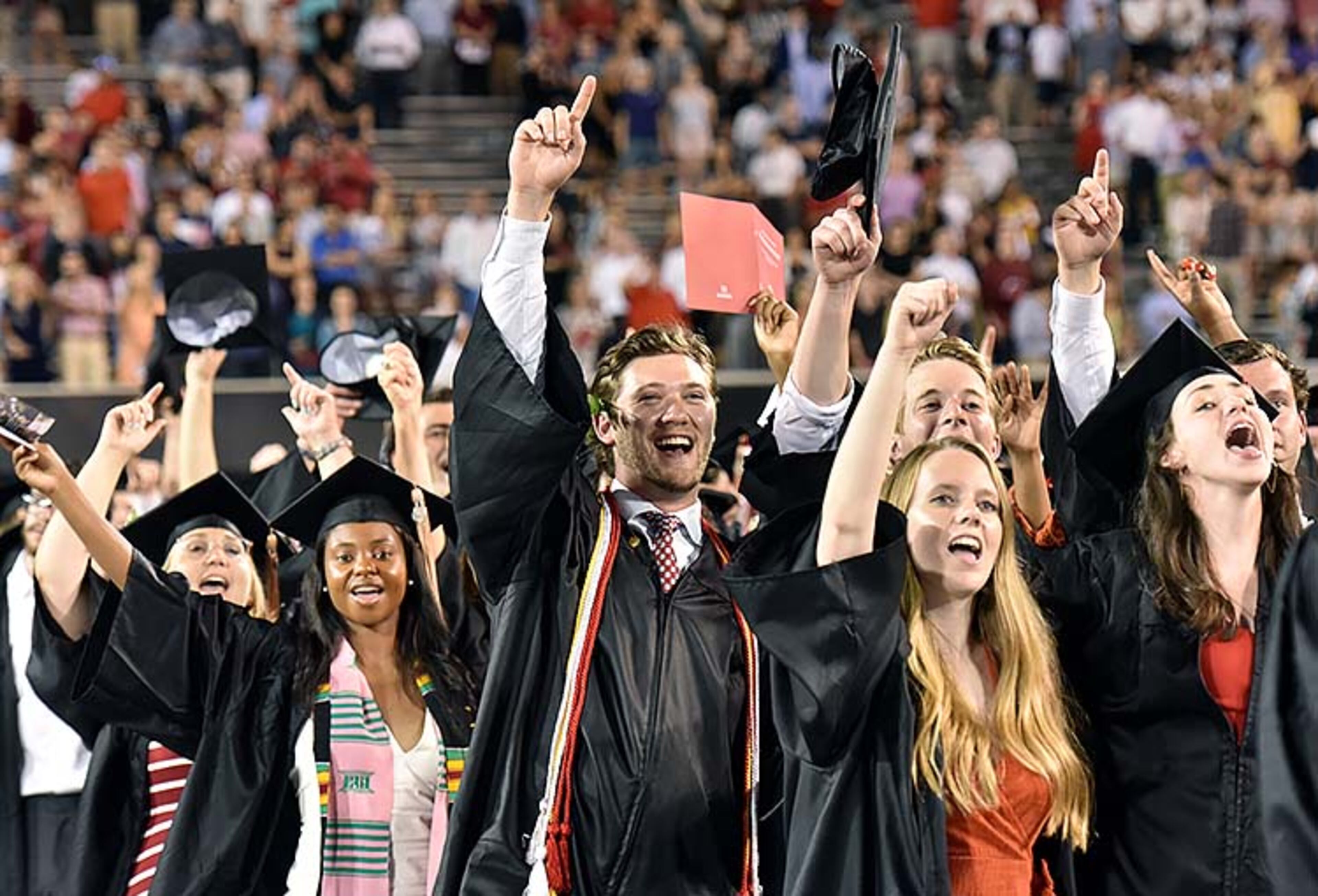 May 10, 2019 Athens - Students sing Alma Mater during UGA's 2019 spring undergraduate commencement ceremony at Sanford Stadium in Athens on Friday, May 10, 2019. HYOSUB SHIN / HSHIN@AJC.COM