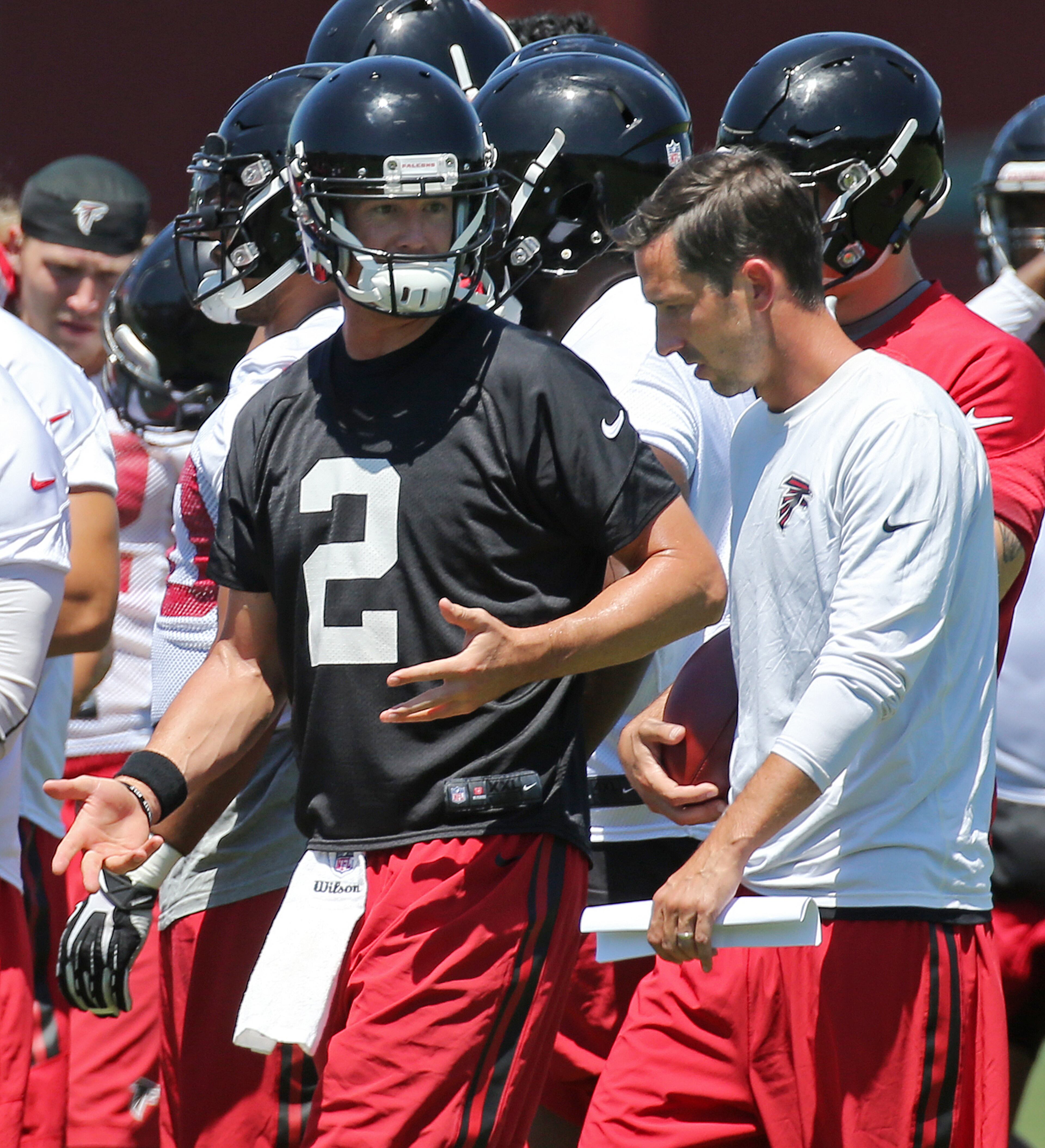 Falcons offensive coordinator Kyle Shanahan and Matt Ryan confer during an OTA day on Tuesday, June 7, 2016, in Flowery Branch. Curtis Compton / ccompton@ajc.com