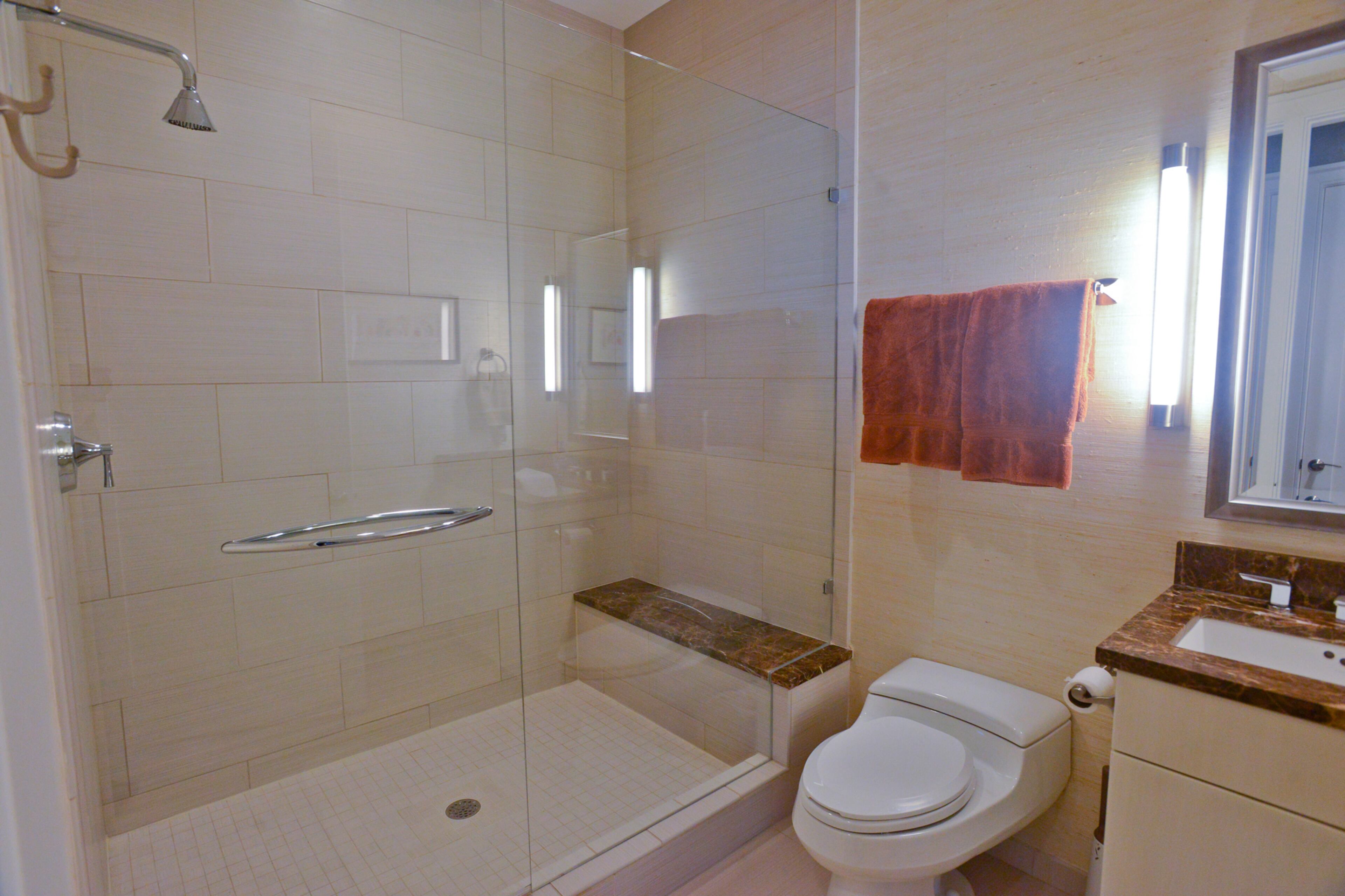 A recent convert to the idea of decorating with wallpaper, homeowner Jim Wilson was inspired to paper his guest bathroom in white metallic sisal from Wallpaper & Stuff after seeing it used on bathroom walls in the Lowe's Atlanta Hotel. The hotel is below the condos in 1065 Midtown.