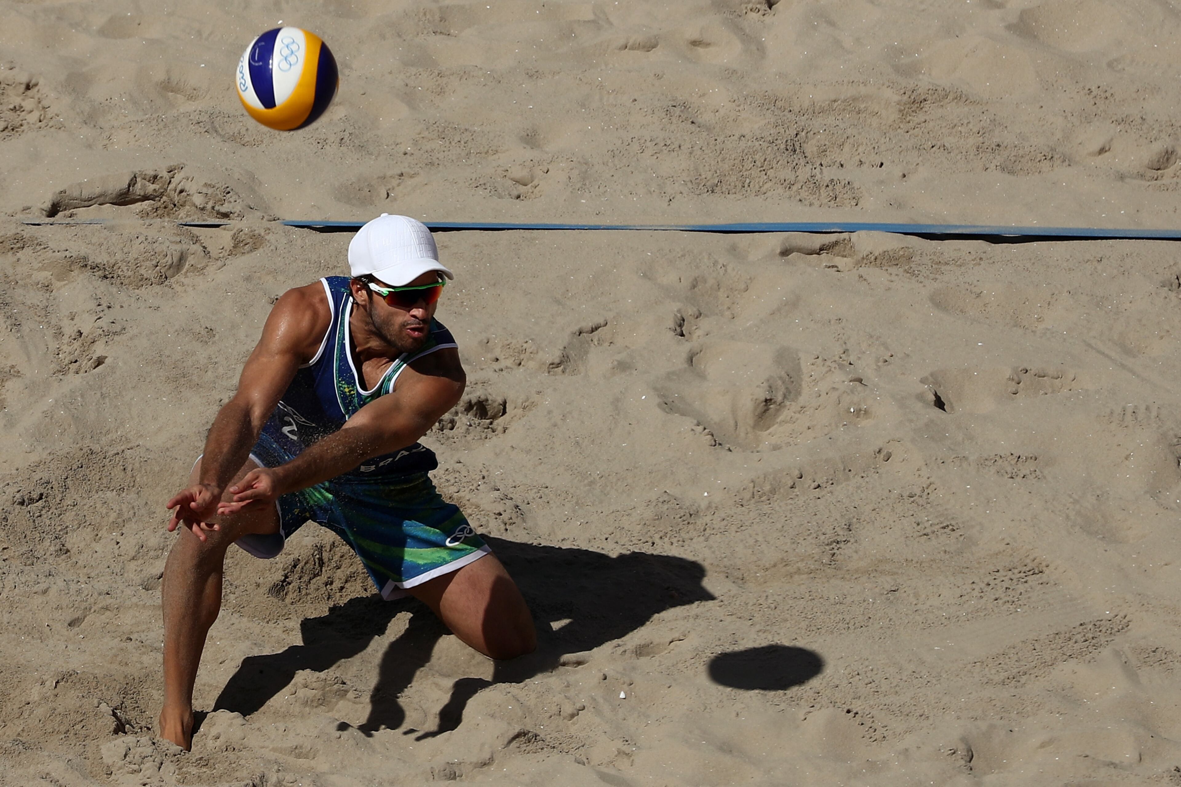RIO DE JANEIRO, BRAZIL - AUGUST 13: Bruno Schmidt Oscar of Brazil plays a shot during a Men's Round of 16 match between Spain and Brazil on Day 8 of the Rio 2016 Olympic Games at the Beach Volleyball Arena on August 13, 2016 in Rio de Janeiro, Brazil. (Photo by Patrick Smith/Getty Images)