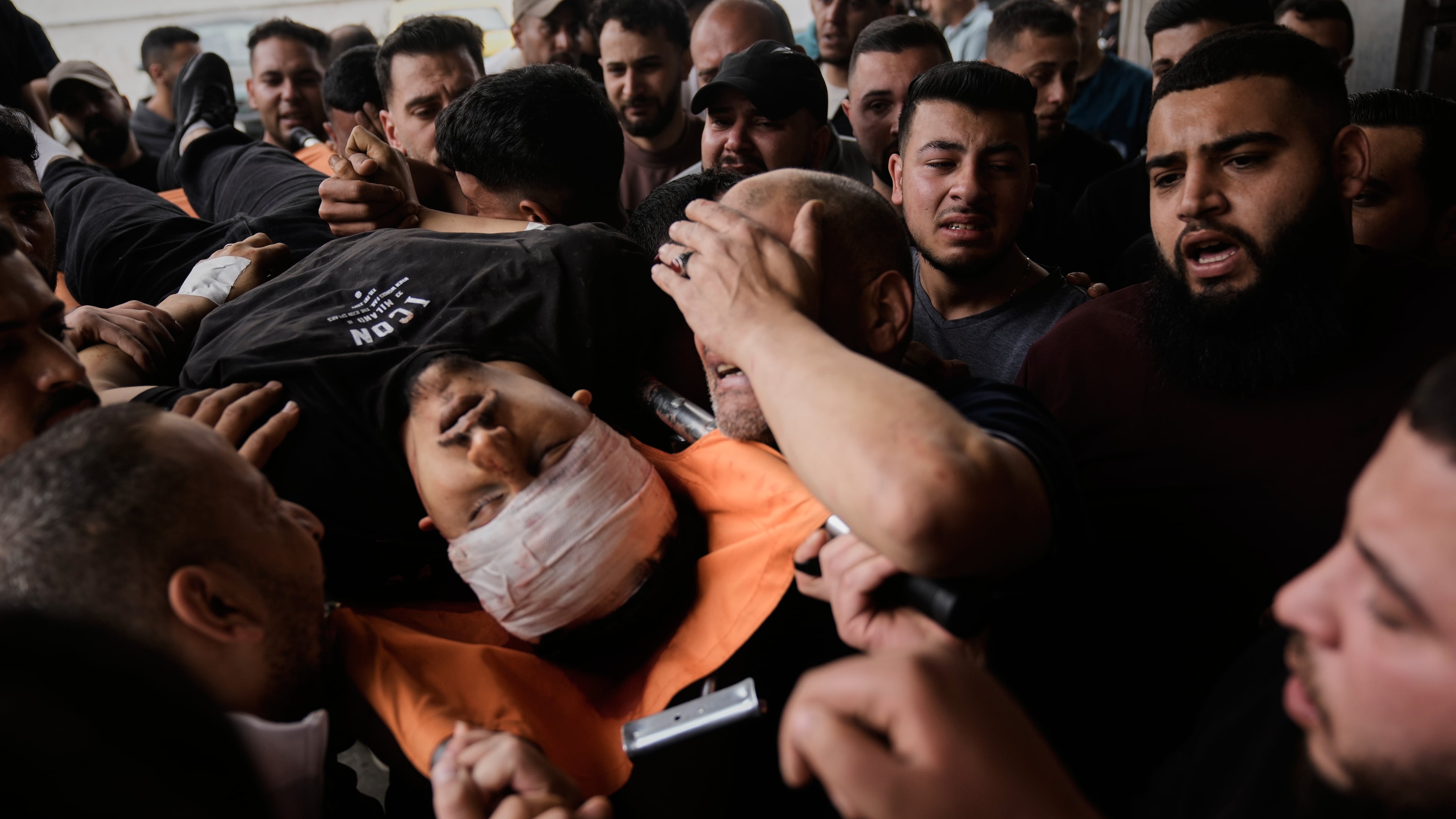 The body of Nayef Samaro, 26, who was killed in clashes with Israeli forces, is brought to Rafidia Hospital in the West Bank city of Nablus, Sunday, May 3, 2026. (AP Photo/Majdi Mohammed)