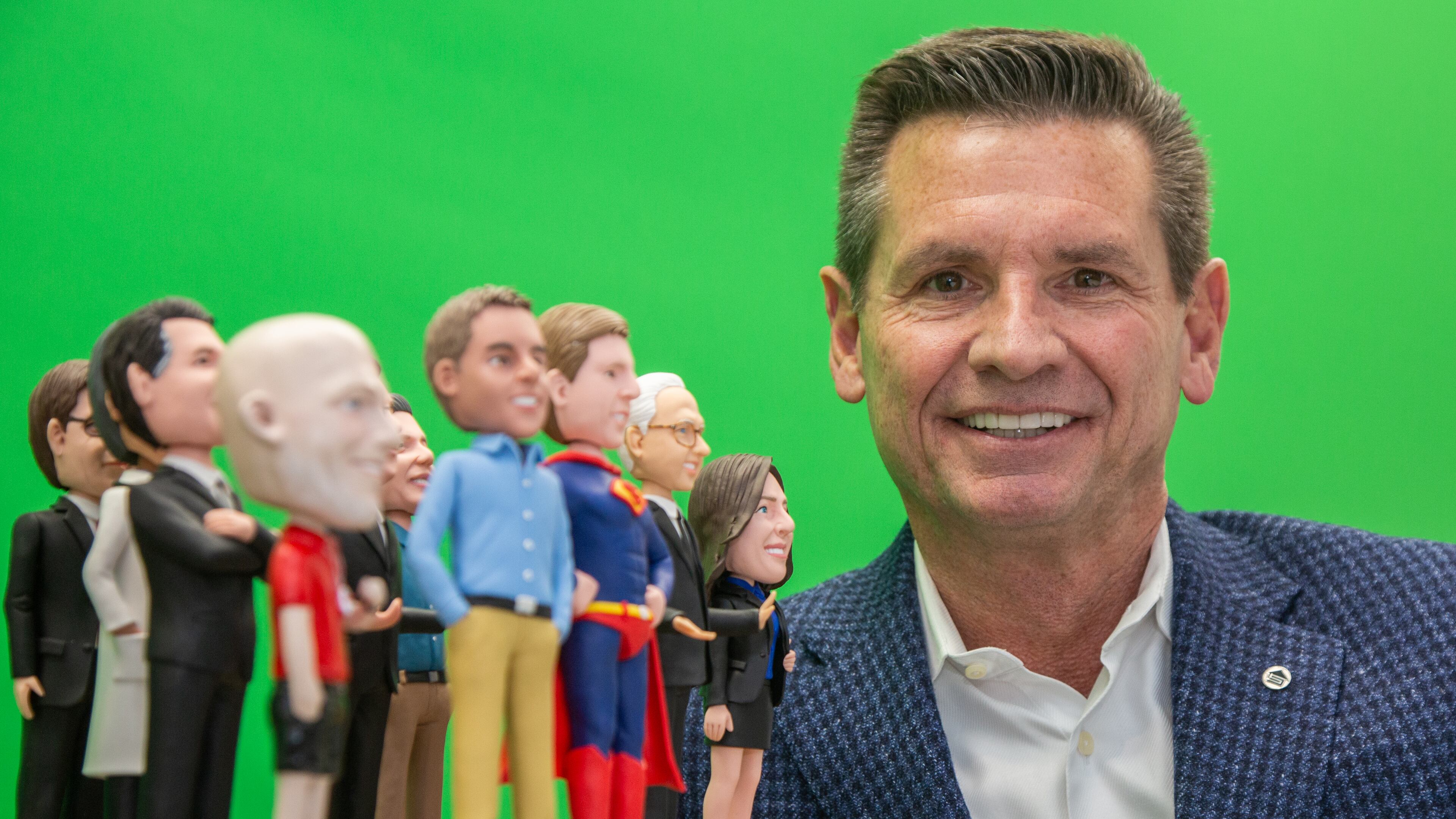 Portrait of CEO Pat Flood with bobblehead dolls that he has had made of the guests that appear on his monthly podcast at the Supreme Lending Southeastern region offices in Alpharetta on Wednesday January 20, 2021. For a story on the Top Workplace midsize category.PHIL SKINNER FOR THE ATLANTA JOURNAL-CONSTITUTION.