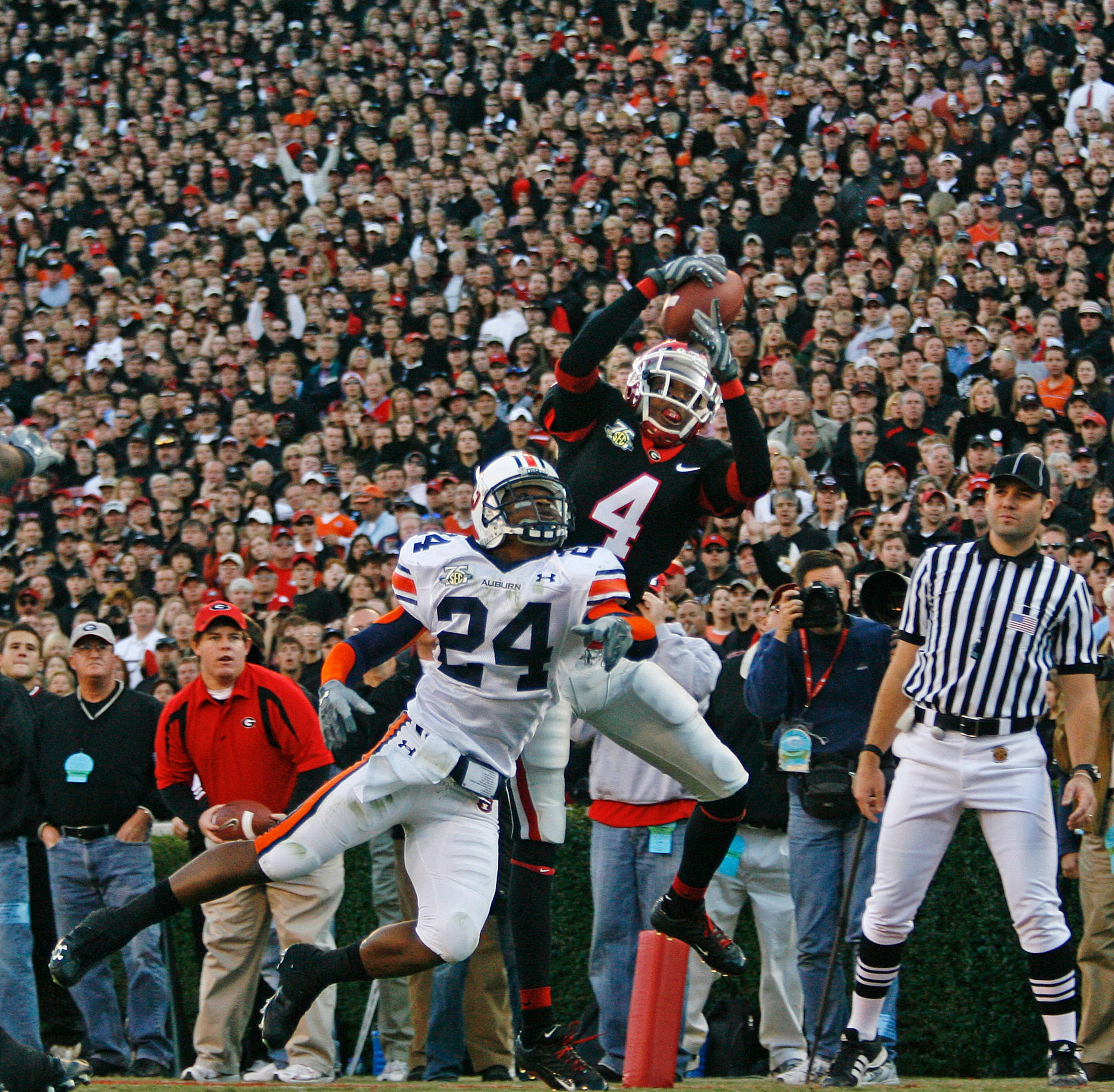 With a black-clad crowd watching, Georgia split end Sean Bailey catches a touchdown pass against Auburn at Sanford Stadium on November 10, 2007. POUYA DIANAT / Staff