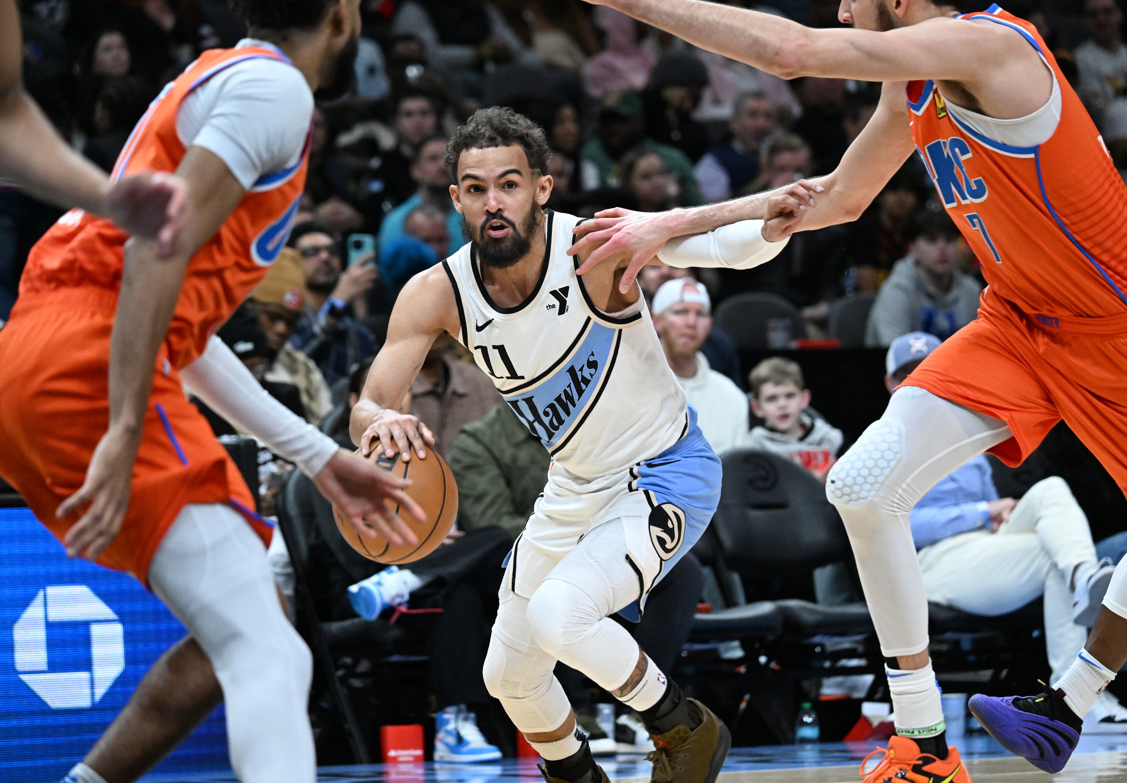 Atlanta Hawks guard Trae Young (11) brings the ball upcourt during the first half in an NBA basketball game at State Farm Arena, Friday, February 28, 2025, in Atlanta. (Hyosub Shin / AJC)