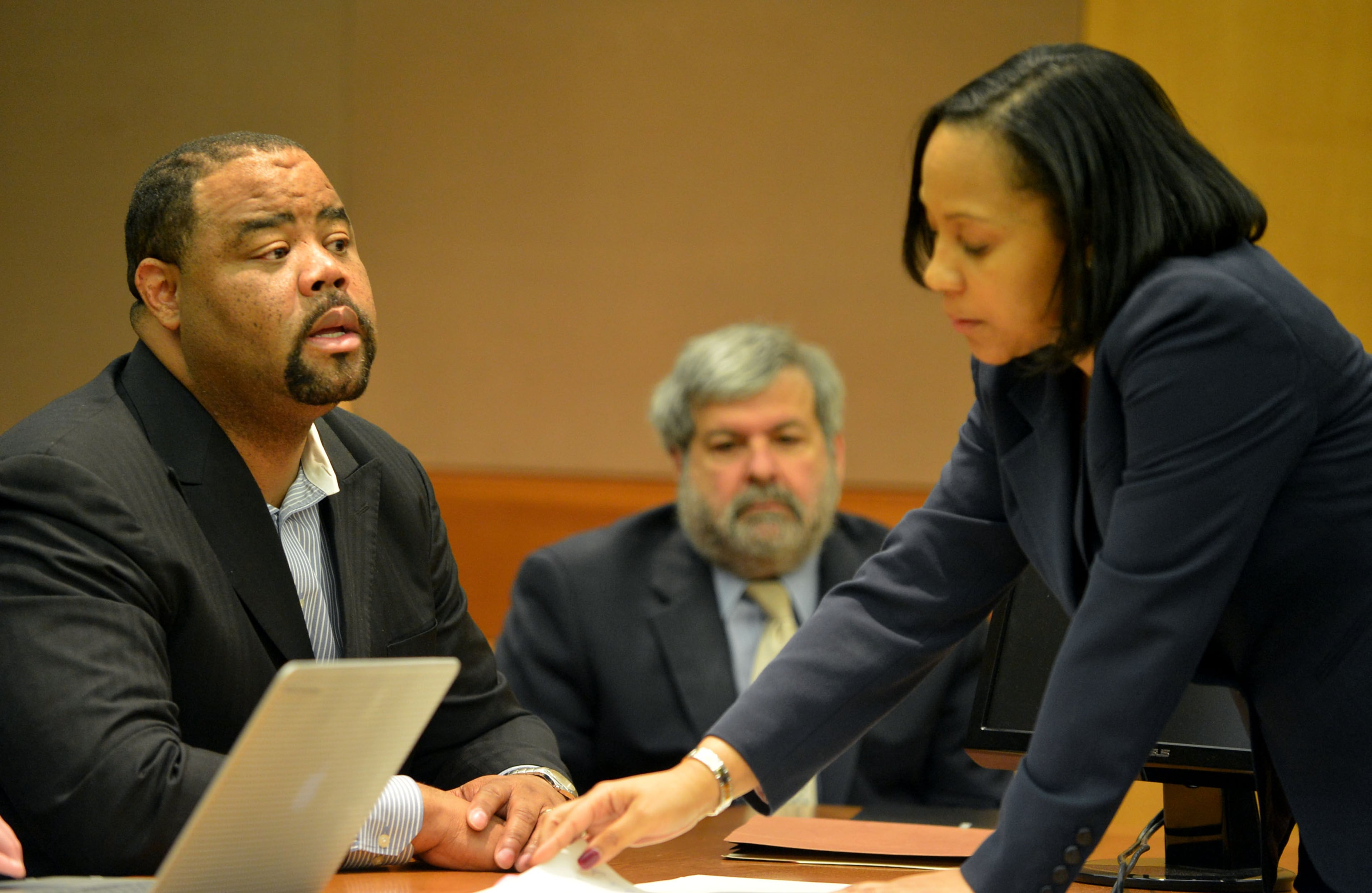 Christopher Waller listens to terms of his plea agreement from Fulton prosecutor Fani Willis during the hearing. Waller, the former principal of Parks Middle School, sits with his attorney, Don Samuel (right), before he pleaded guilty and agreed to cooperate with prosecutors. Waller avoided prison time as a first-time offender. Instead, he must pay $50,000 in fines and restitution, serve five years of probation, perform 1,000 hours of community service and apologize.Educators in the Atlanta Public Schools cheating scandal enter pleas before Judge Jerry Baxter in Fulton County Superior Court Friday, February 21, 2014. Any defendants in the widespread Atlanta Public Schools cheating case who don't make guilty pleas by the end of Friday will likely go on trial this spring, including Superintendent Beverly Hall and senior members of her staff. KENT D. JOHNSON / KDJOHNSON@AJC.COM