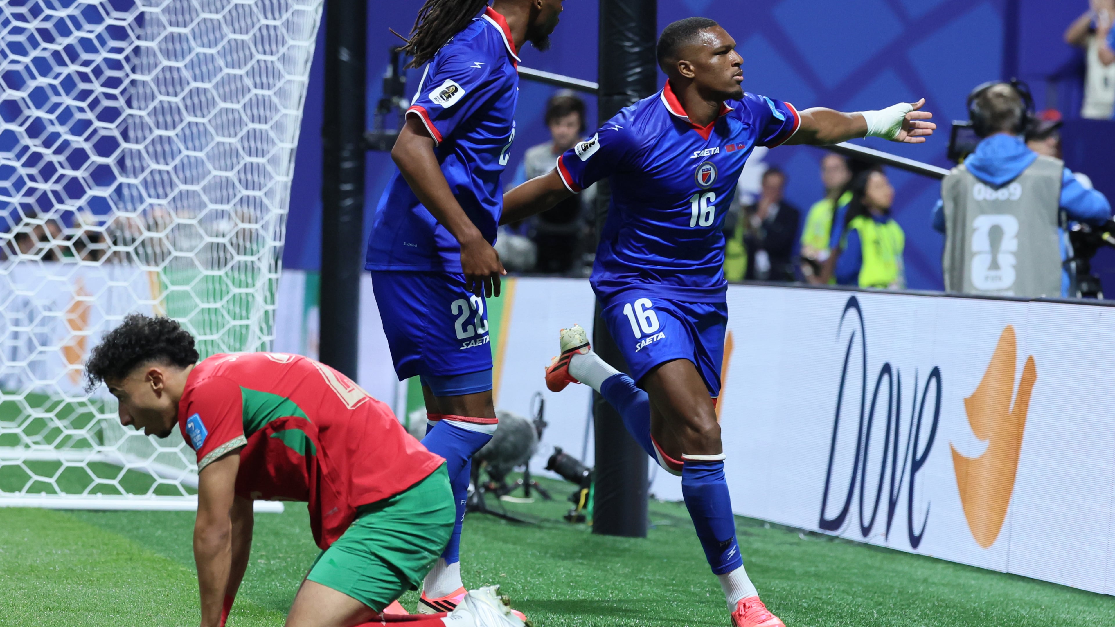 Haiti's Lenny Joseph (right), with teammate Jean-Kevin Duverne (center), celebrates his team's first goal in the 2026 World Cup and first in World Cup competition in 52 years, as Morocco's Anass Salah Eddine is dejected during the Morocco vs. Haiti Group C FIFA World Cup match in Atlanta, on Wednesday, June 24, 2026. (Jason Getz/AJC)