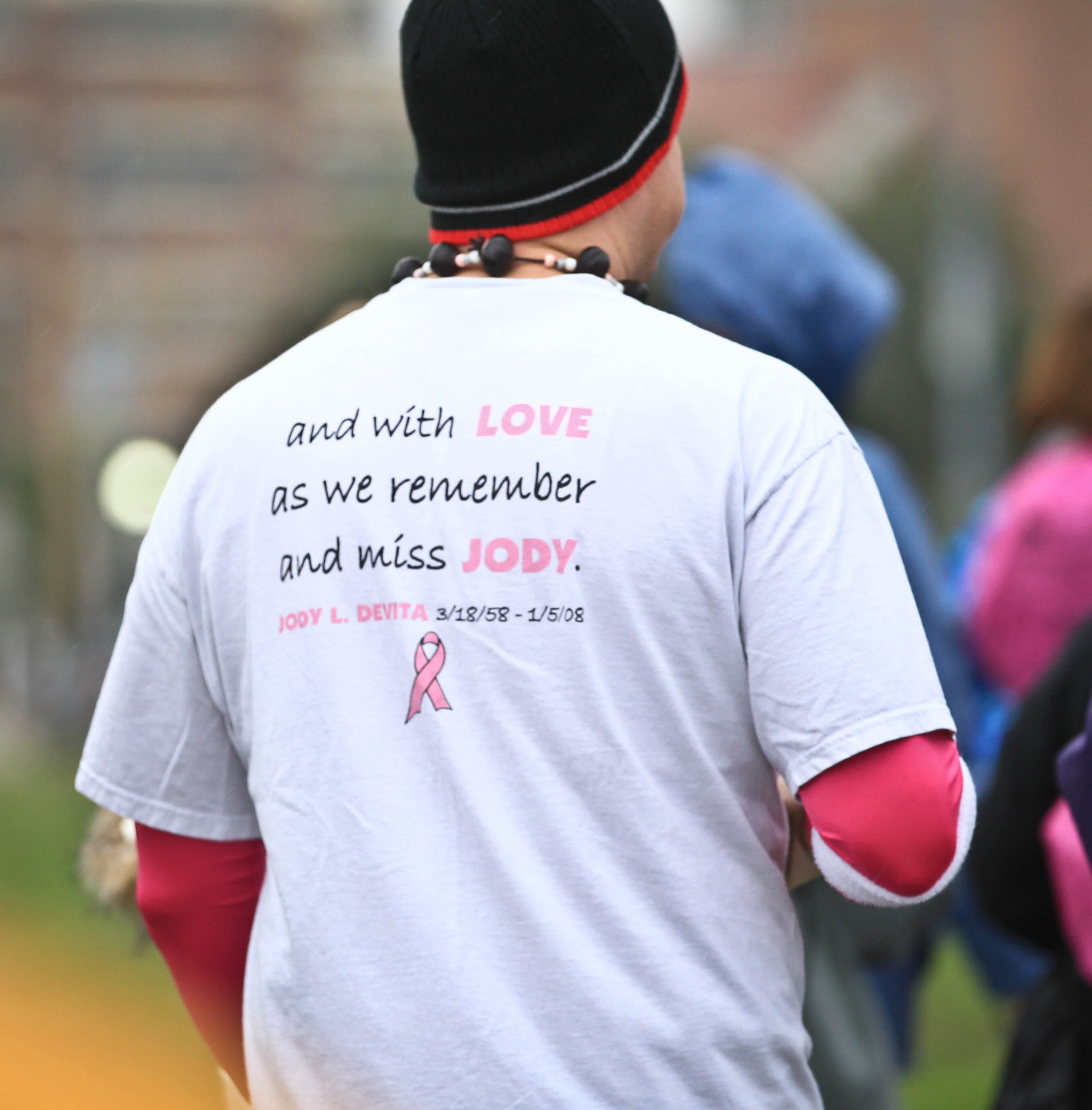Despite the rainy conditions, participation was high at the Making Strides Against Breast Cancer Walk in Dayton at Fifth Third Field Saturday morning. JIM WITMER / STAFF