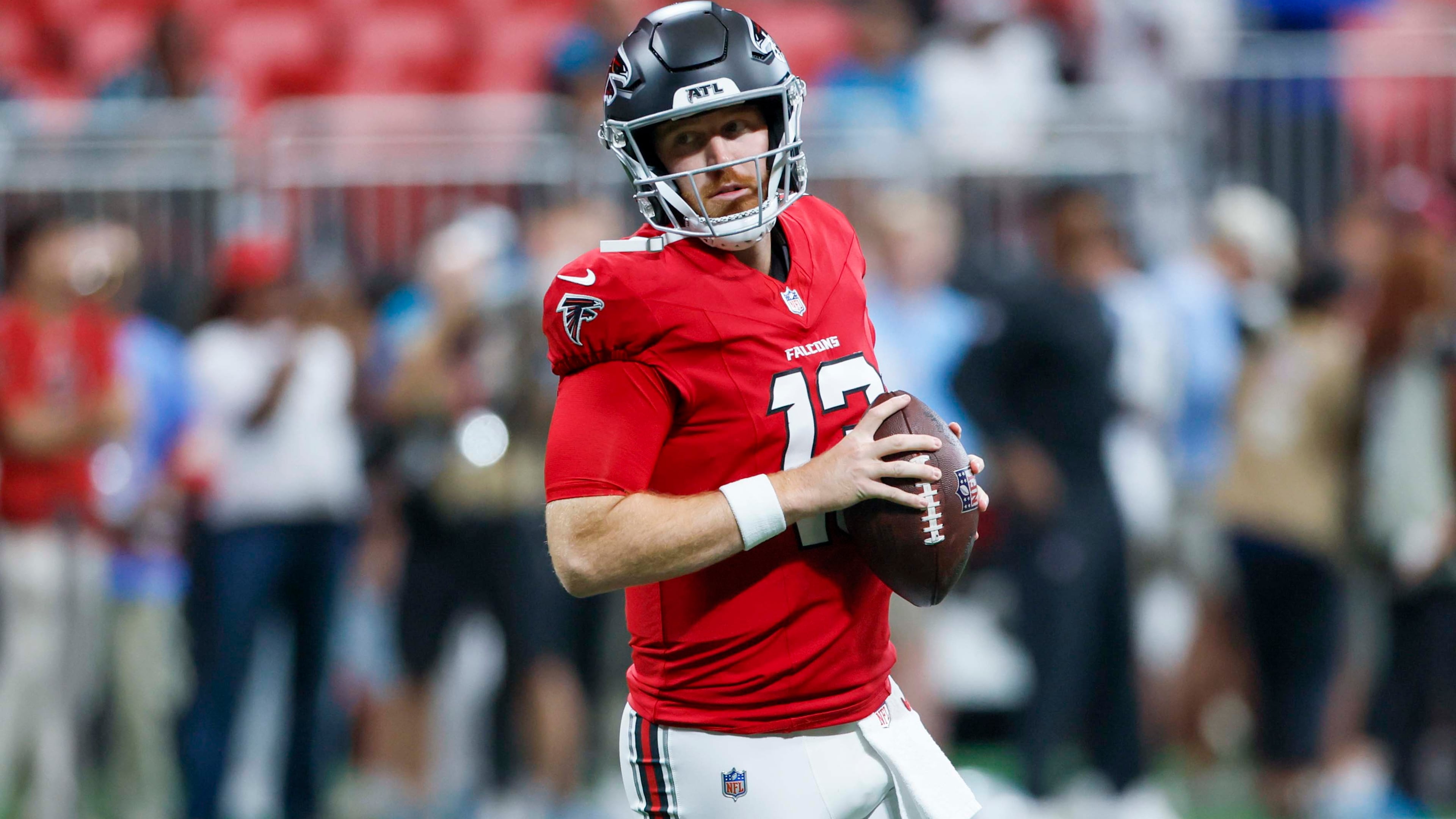 Atlanta Falcons quarterback Cooper Rush runs with the ball during warm-ups before the game against the Carolina Panthers at Mercedes-Benz Stadium in Atlanta on Sunday, Sept. 20, 2026. (Miguel Martinez/AJC)