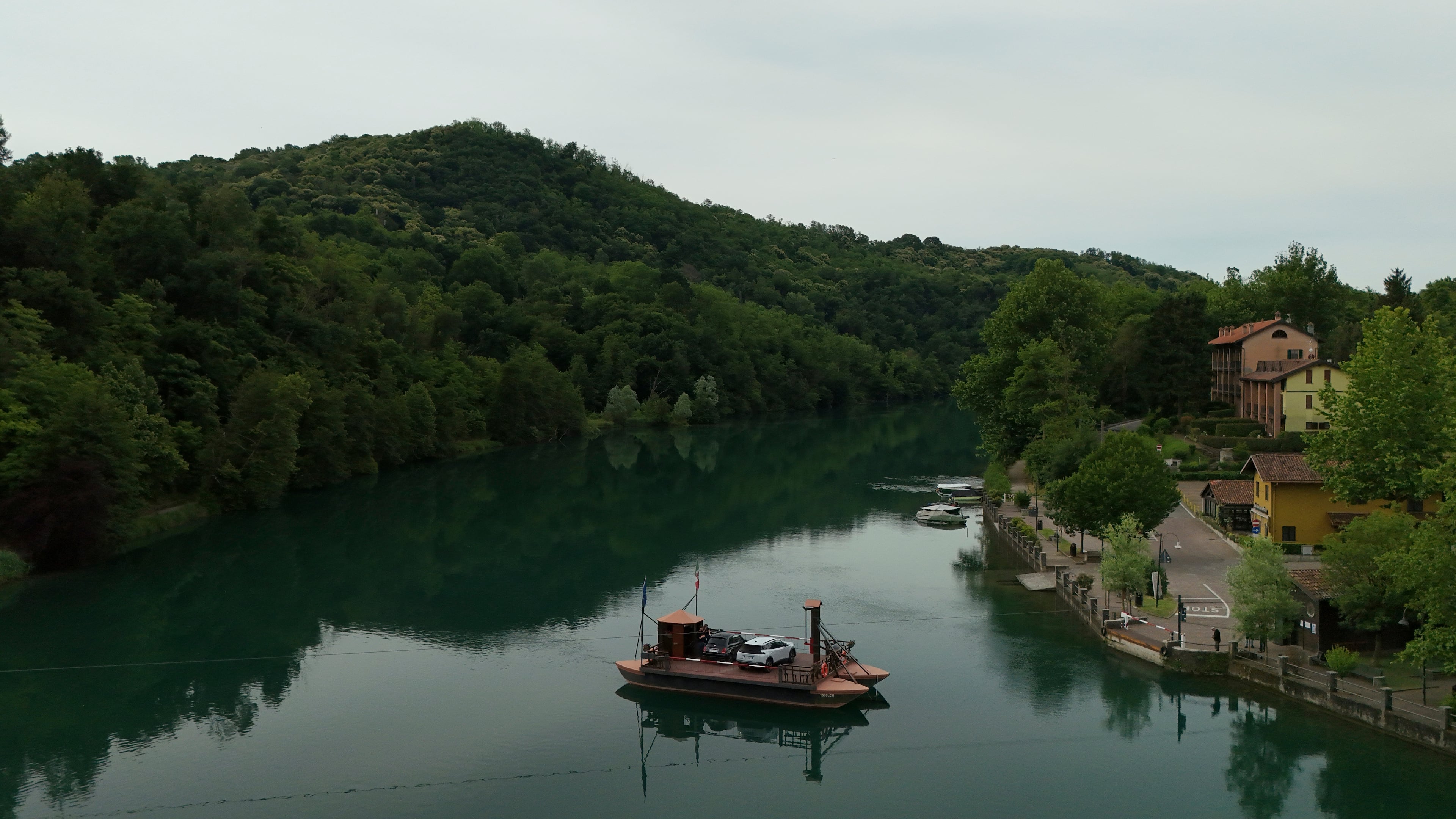 Commuters board the “Da Vinci Ferry,” a hand-operated ferry based on a design sketched by Leonardo da Vinci in the 15th century, on the Adda River between the provinces of Lecco and Bergamo, in Imbersago, Italy, Thursday, June 4, 2026. (AP Photo/Luca Bruno)