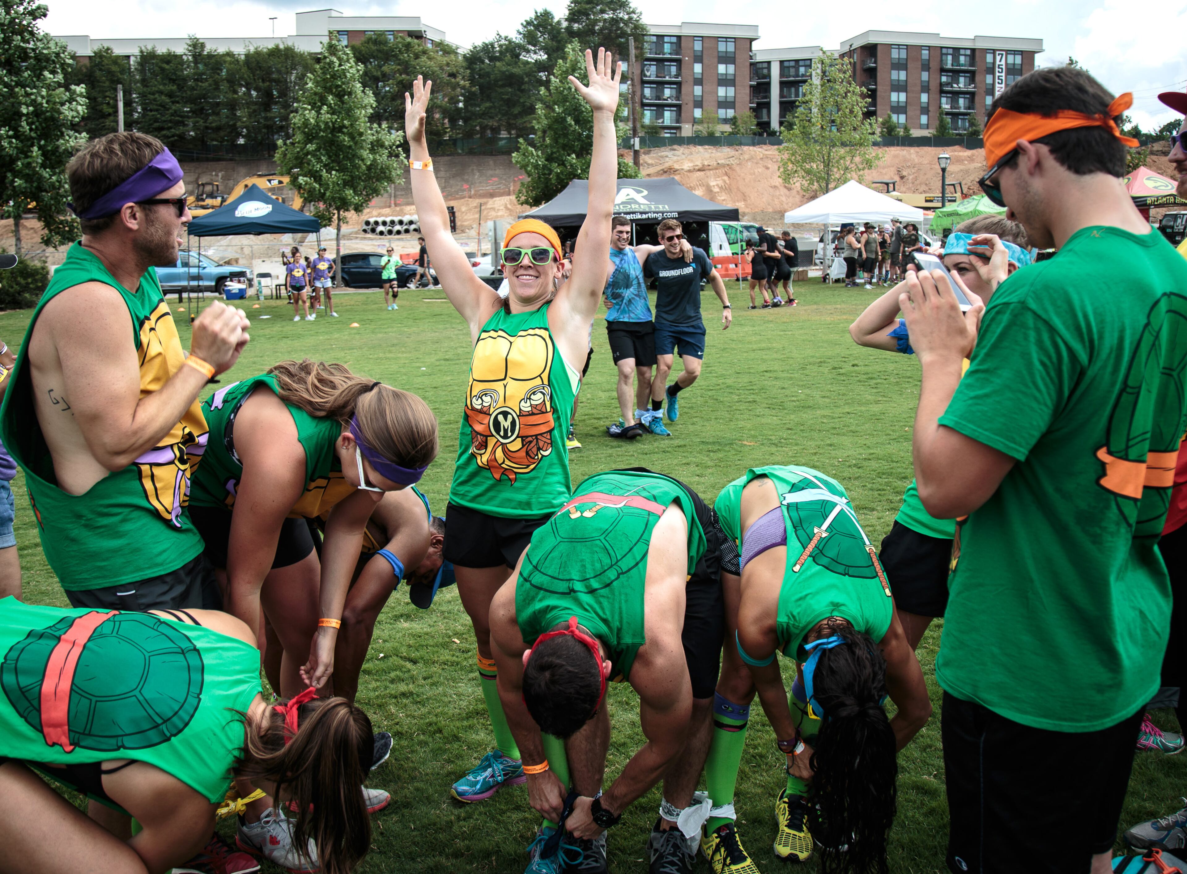 Sarah Young celebrates after her team, Past Our Prime, won the Five legged Race during Atlanta Field Day in Atlanta, Ga. Saturday, July 16, 2016. STEVE SCHAEFER / SPECIAL TO THE AJC