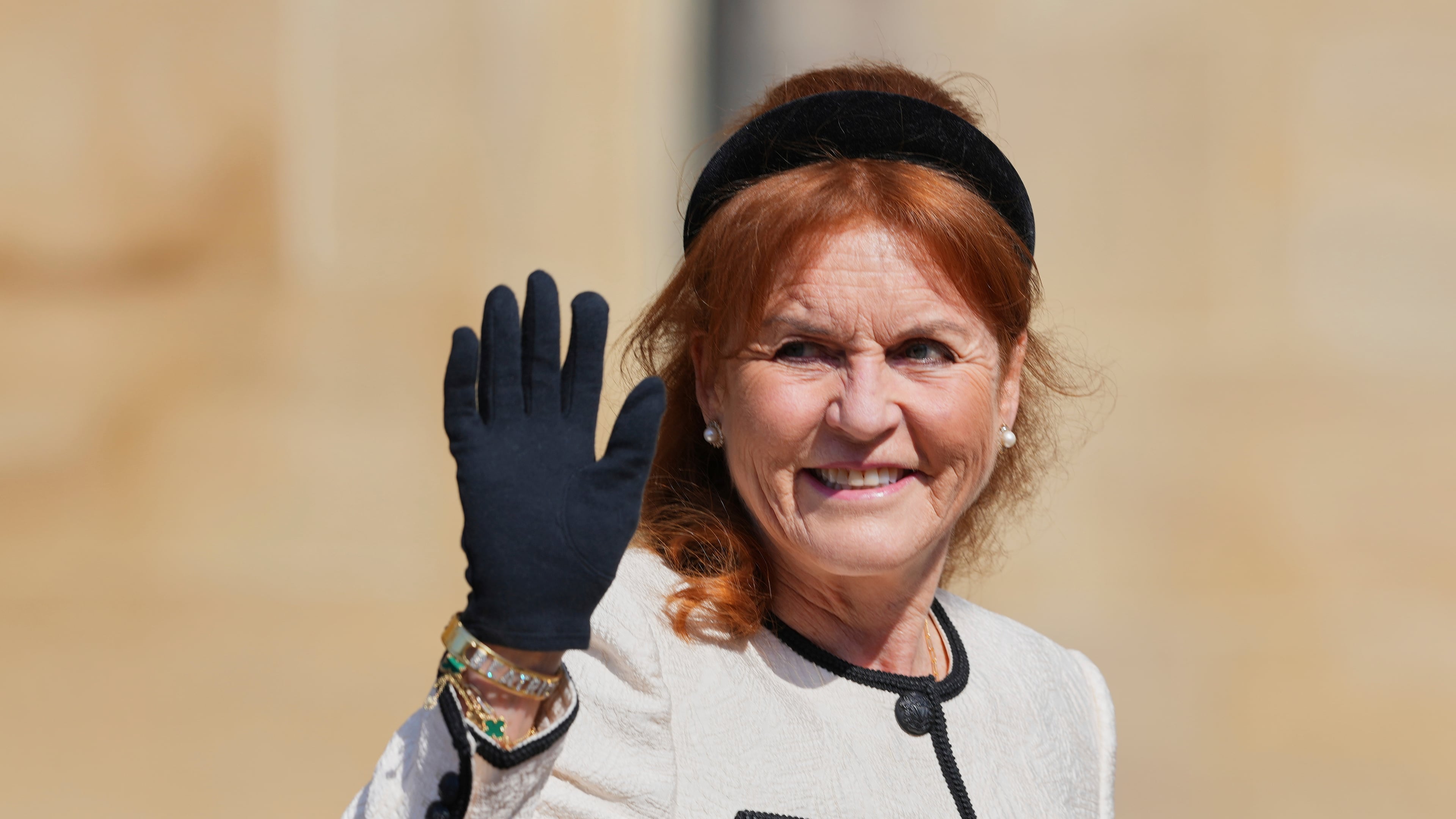 FILE - Sarah Ferguson waves the to the crowd was she attends the Easter Matins Service at St. George's Chapel, Windsor Castle, England, Sunday, April 20, 2025. (AP Photo/Kirsty Wigglesworth, file)