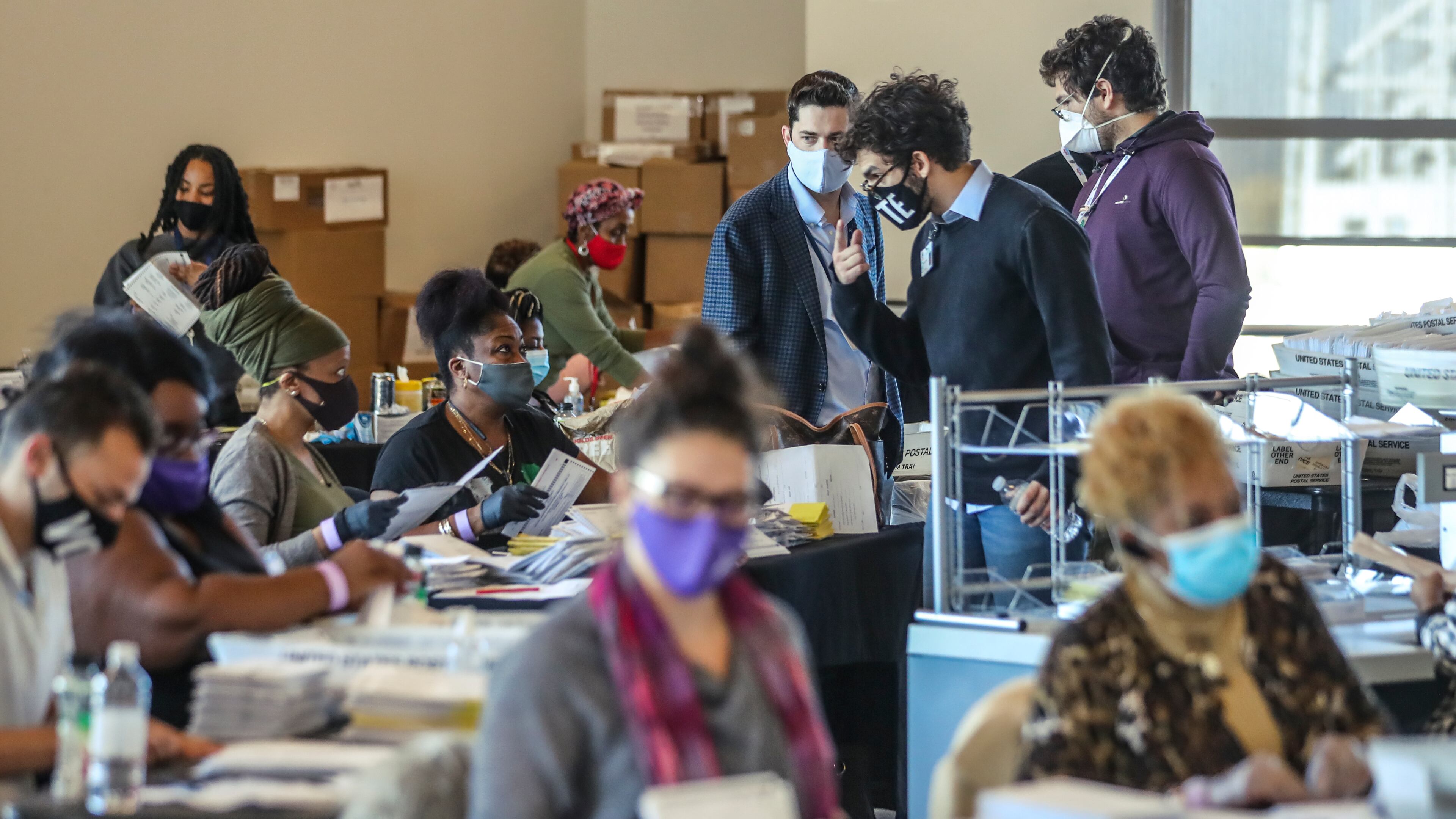 November 5, 2020 Atlanta: Fulton County election workers were hard at it again on Thursday, Nov. 5, 2020 counting ballots at State Farm Arena. Fulton County officials say election workers have completed processing absentee-by-mail ballots. Fulton elections head Richard Barron said that 145,748 absentee-by-mail ballots have been processed. Of that, he said, results of 138,000 have been posted online and 1,200 more absentees that required more signature verification will come later today — meaning there’s a difference of roughly 7,000 between what’s been processed and what’s been posted. There are still 3,600 provisional ballots and an undetermined amount of military overseas ballots left to be finalized. The deadline for those is 5 p.m. Friday. (John Spink / John.Spink@ajc.com)