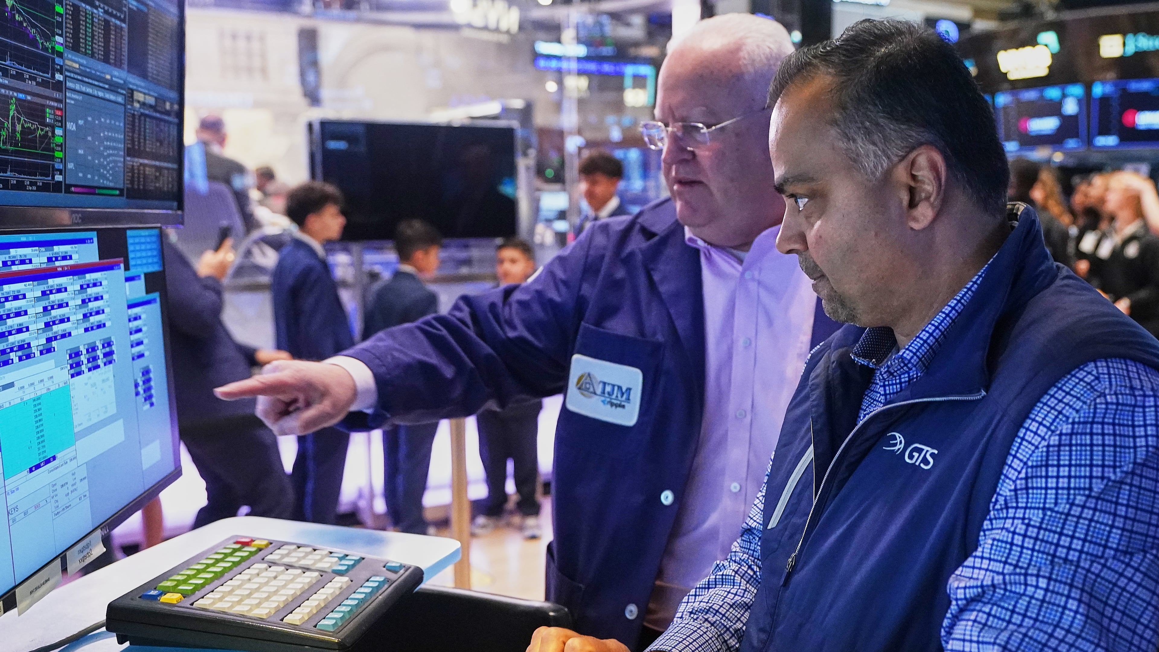 Trader Thomas Ferrigno, left, and specialist Dilip Patel work on the floor of the New York Stock Exchange, Thursday, April 23, 2026. (AP Photo/Richard Drew)