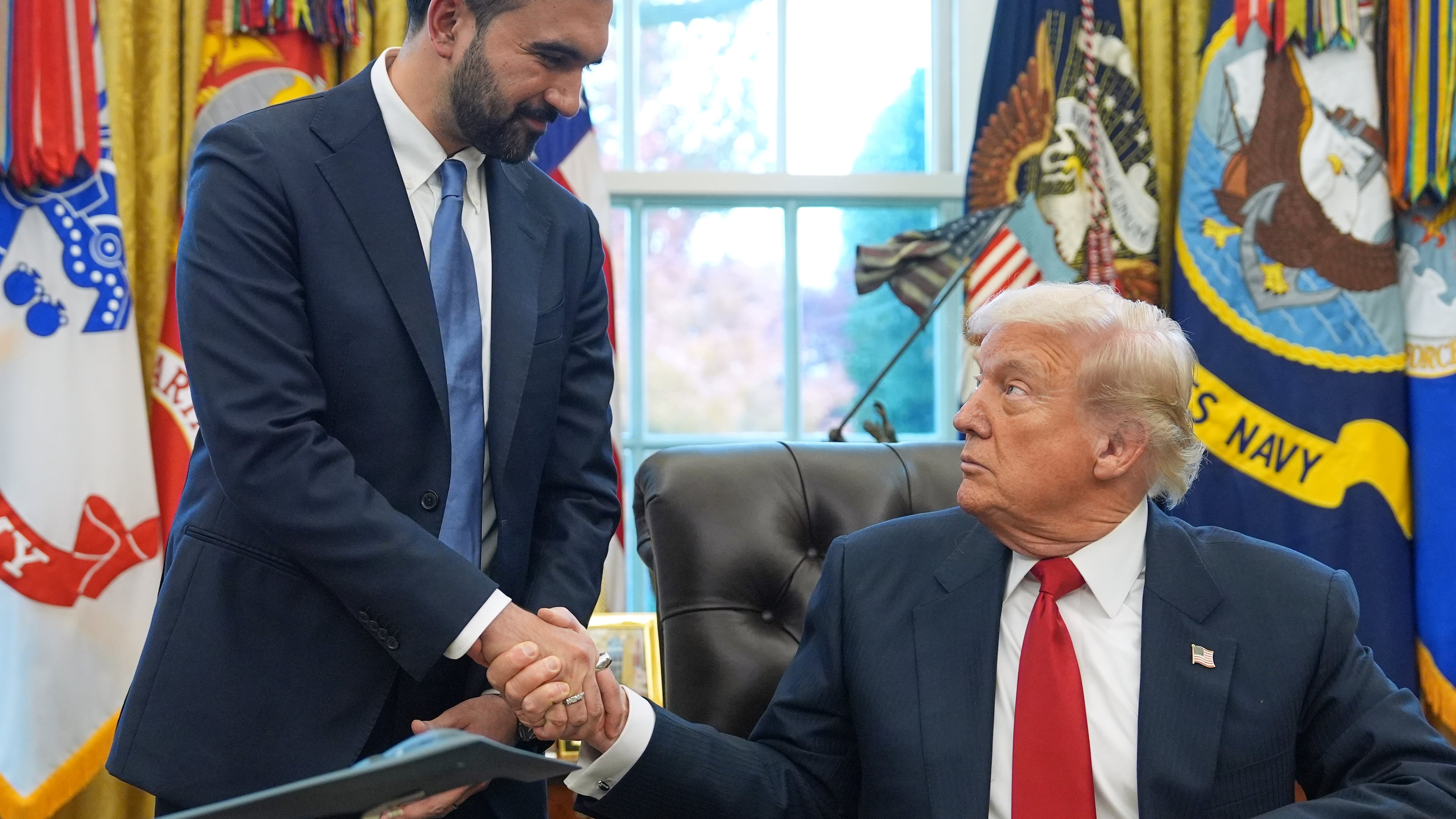 FILE - President Donald Trump shakes hands with New York City Mayor-elect Zohran Mamdani in the Oval Office of the White House, Nov. 21, 2025, in Washington. (AP Photo/Evan Vucci, File)