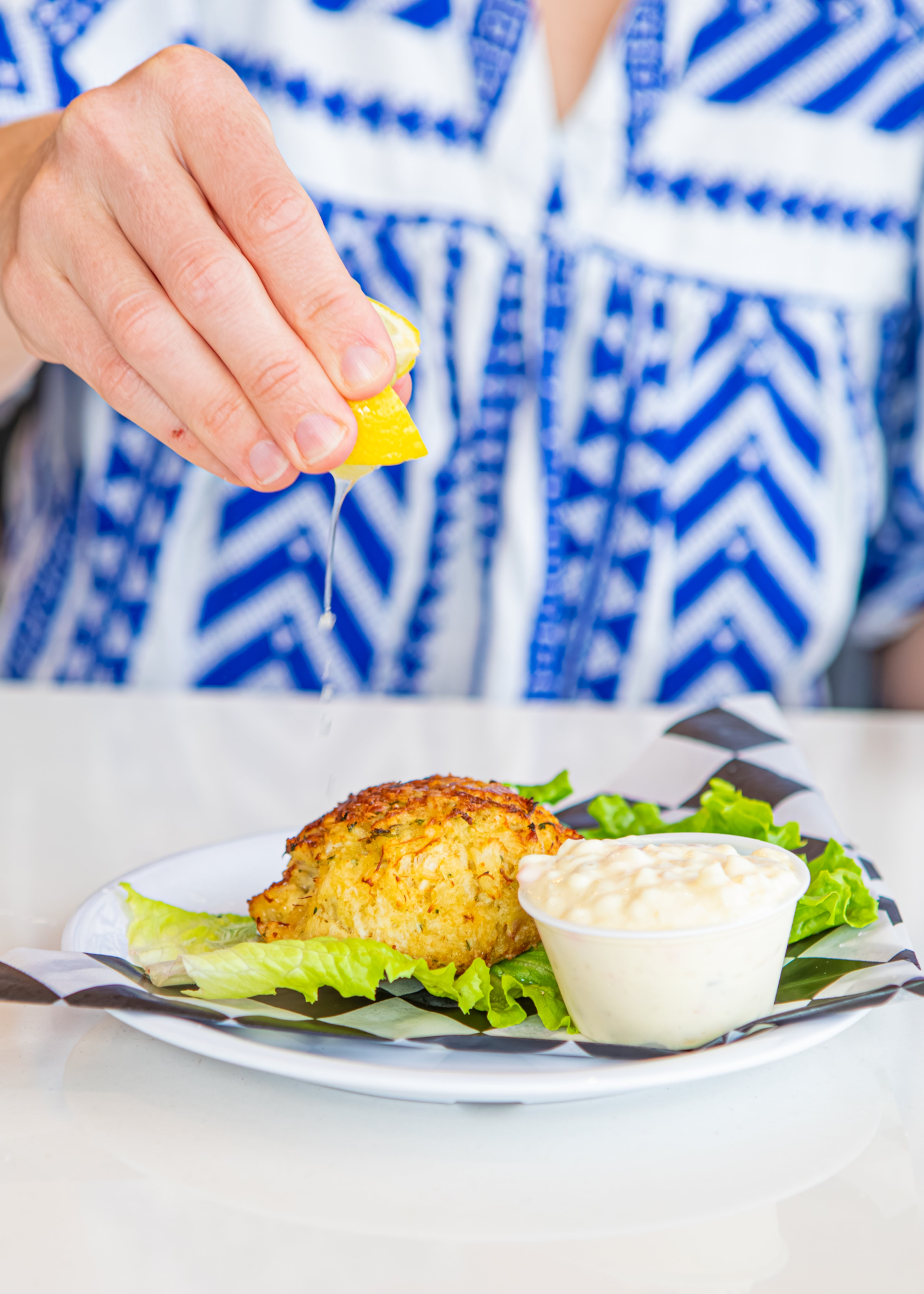 Phillips Seafood in ATL's Concourse D is known for its crabcake. (Aaliyah Man for the AJC)