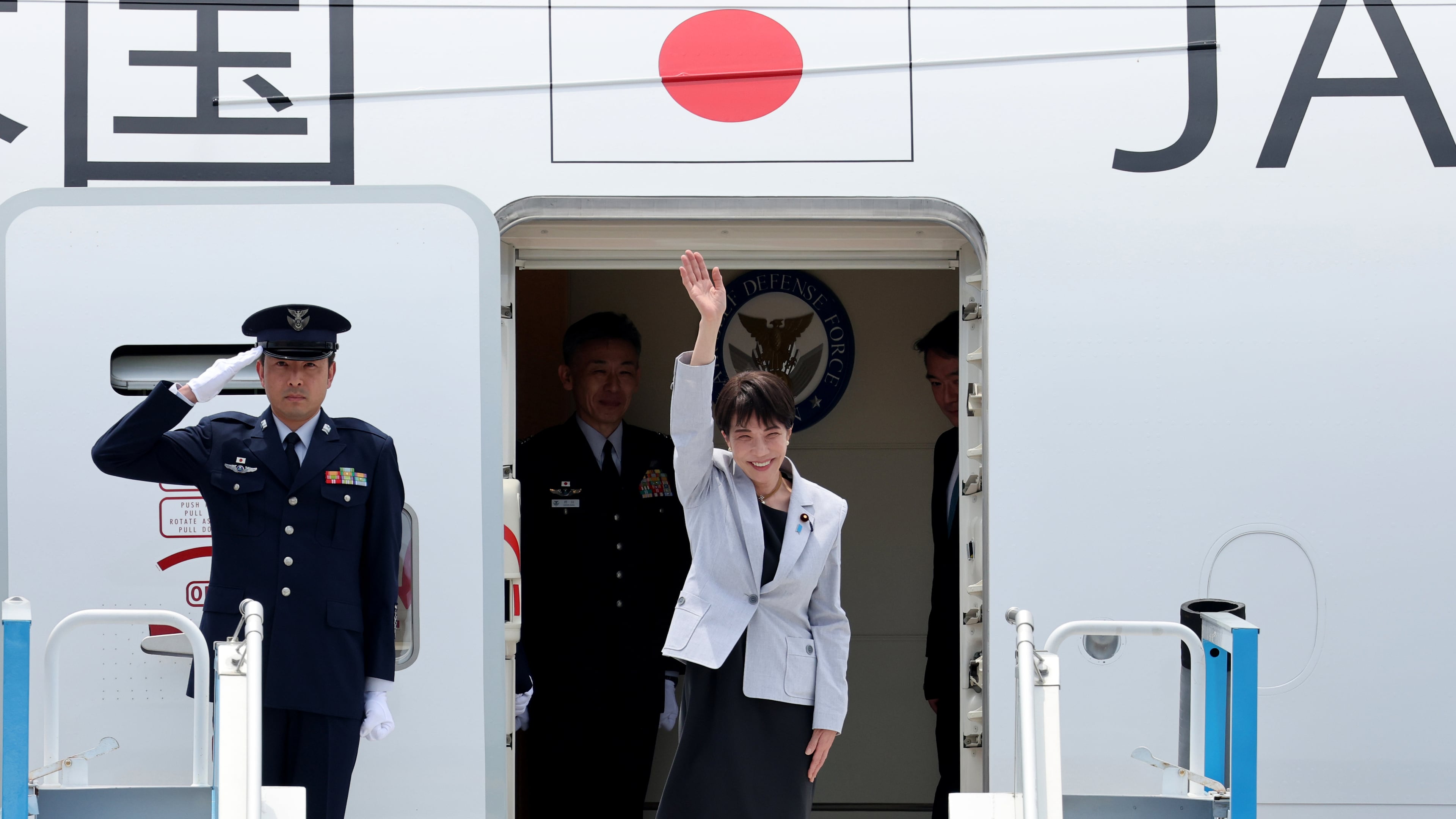 Japan's Prime Minister Sanae Takaichi waves upon arrival at the Daegu International Airport in Daegu, South Korea, Tuesday, May 19, 2026. (Yoon Kwan-shick/Yonhap via AP)