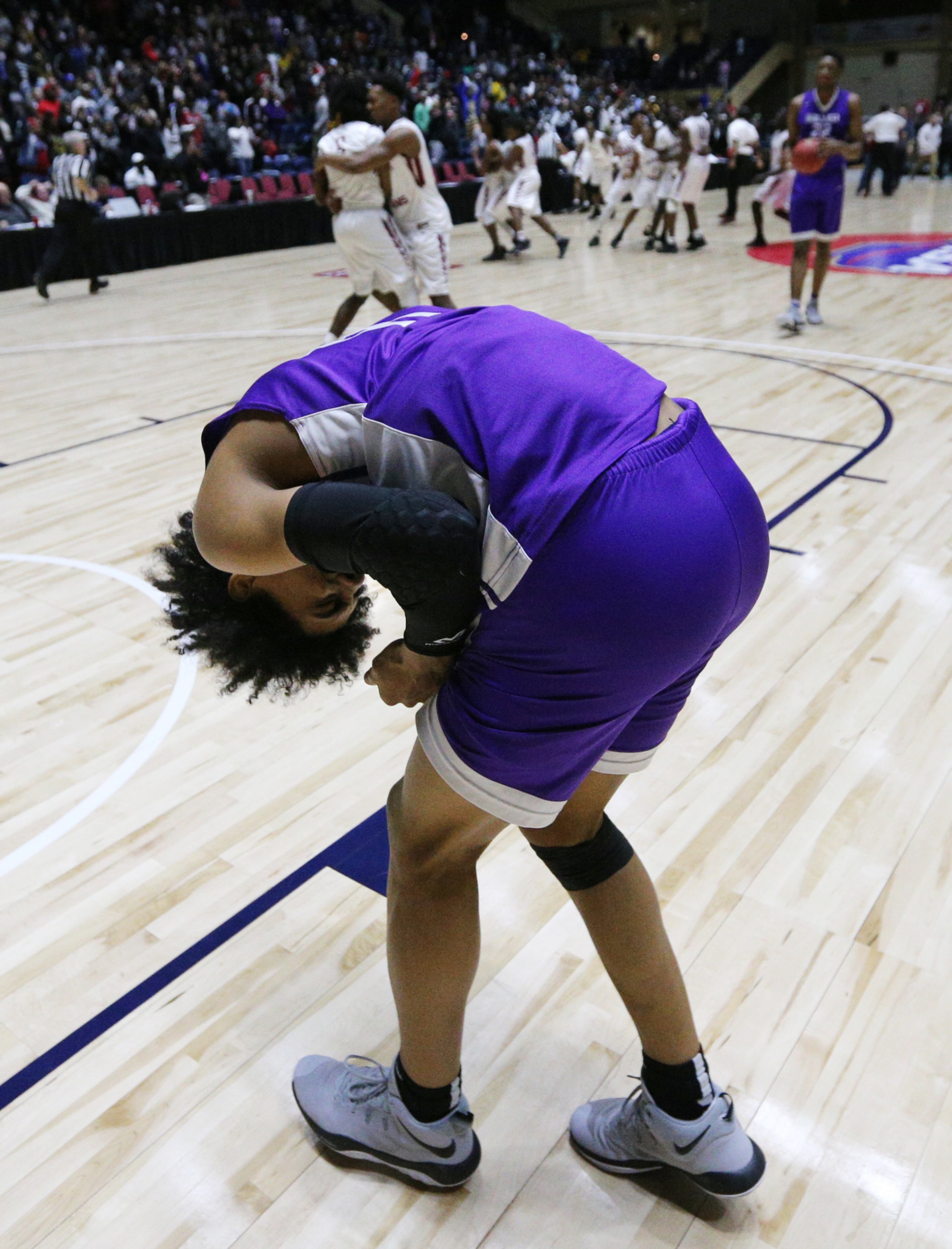 March 8, 2018 Macon: Miller Grove guard Terrence Edwards bends over dejected after Warner Robins guard Jacolbey Owens hit a three point shot in the final seconds for a 67-64 victory in their GHSA state basketball championship game on Thursday, March 8, 2018, in Macon. Curtis Compton/ccompton@ajc.com