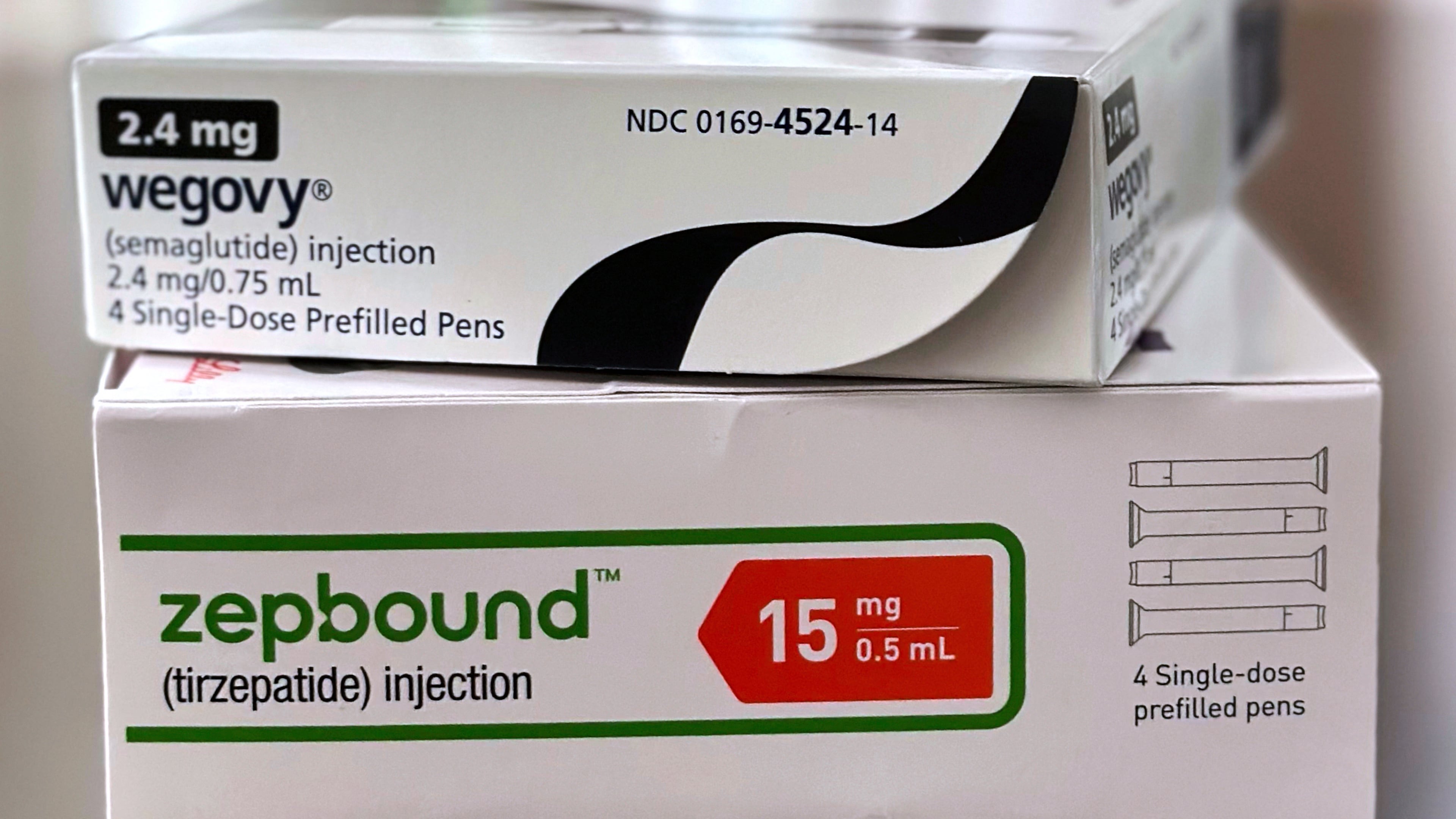 FILE - Boxes for the medications Wegovy and Zepbound are arranged for a photograph in California, May 8, 2025. (AP Photo/JoNel Aleccia, File)