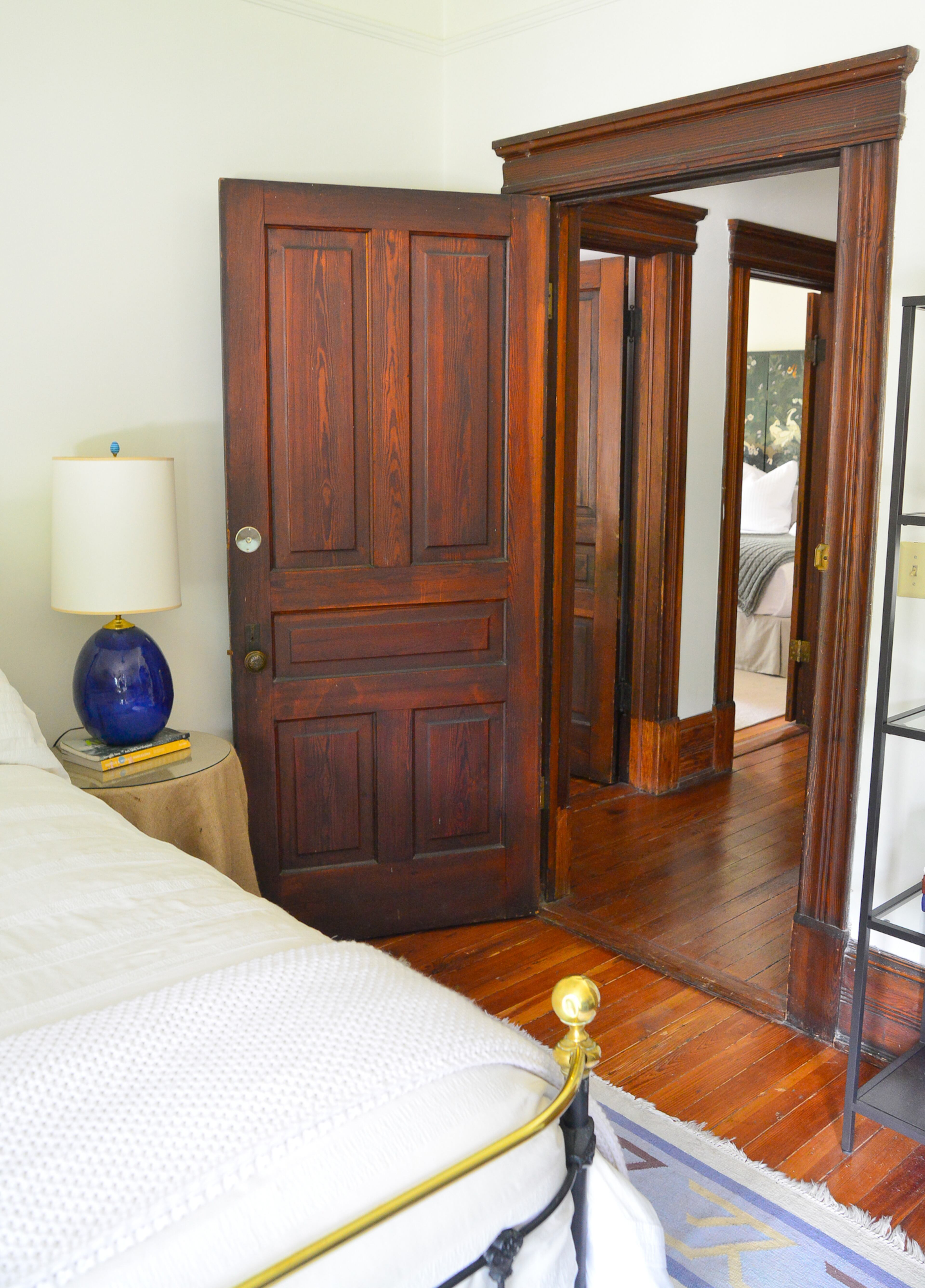 An antique brass bed anchors the guest bedroom in Nicholas and Elliott Niespodziani's 3,800-square foot Atlanta Victorian. The 120-year-old home was believed to be used as a boarding house in the mid-20th century. "This house has so much history," says Nicholas. "It's fun to think of all of the lives it has touched over the years."