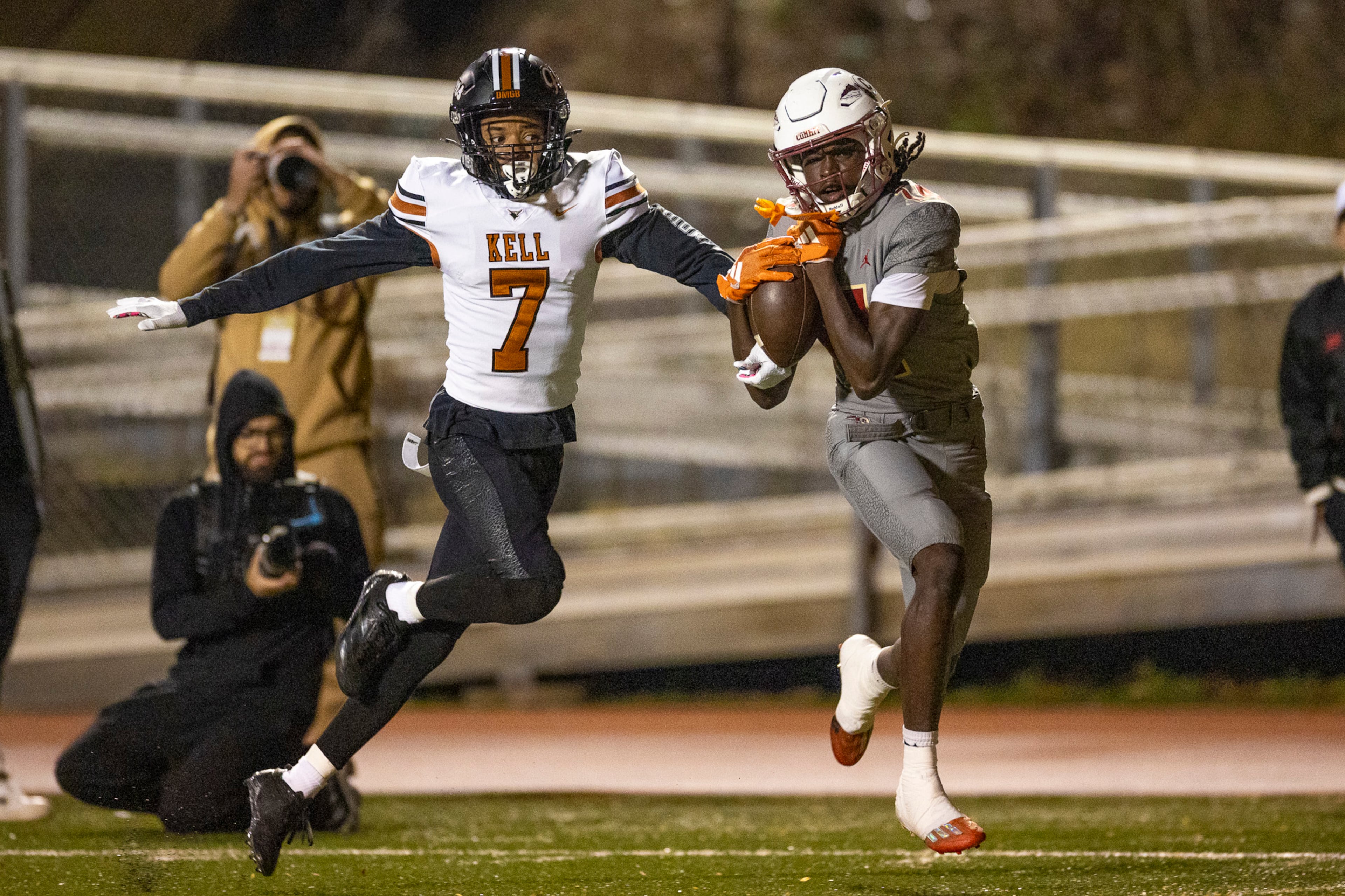 Creekside wide receiver Armani Hill (right) makes a catch while Kell defensive back Robert Tyson Jr. tries to intercept during their Class 4A semifinal game on Friday, Dec. 5, 2025, at Creekside High School in Fairburn. (Oscar Guevara Saenz for the AJC)