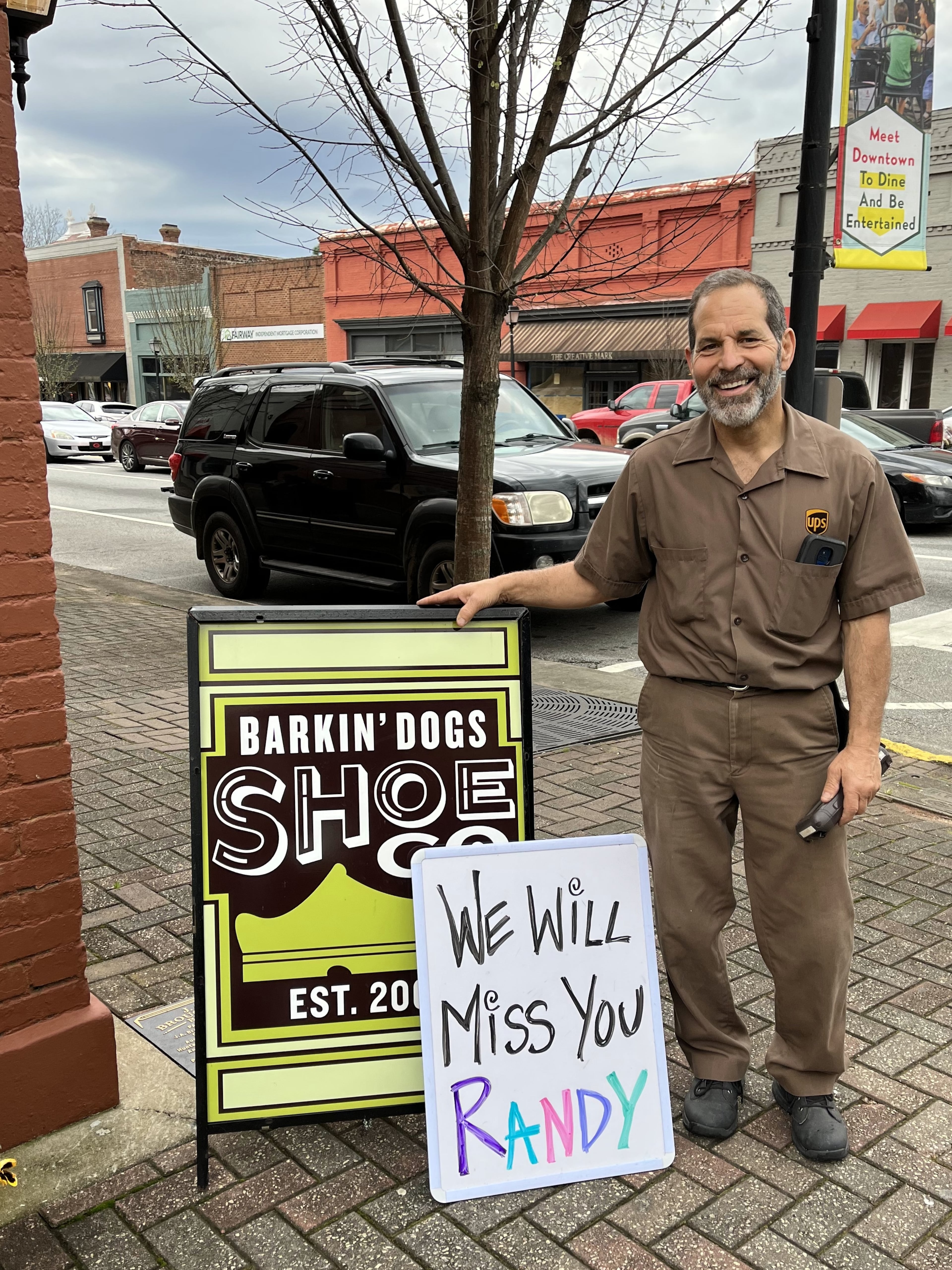 UPS delivery man Randy Pace is given an official farewell at Barkin’ Dog Shoes in Madison. (Courtesy of Becca Tamplin)