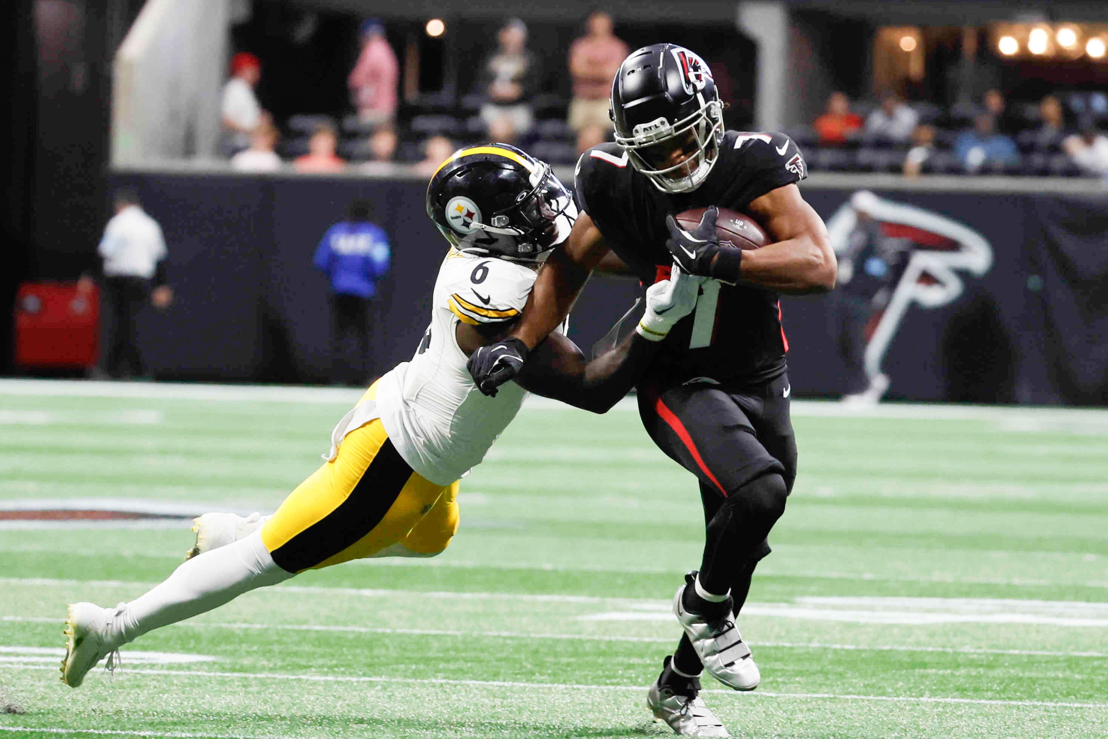 Falcons running back Bijan Robinson avoids a tackle from Steelers linebacker Patrick Queen during the first half of an NFL football game on Sunday, Sept. 8, at Mercedes-Benz Stadium in Atlanta.
(Miguel Martinez/ AJC)