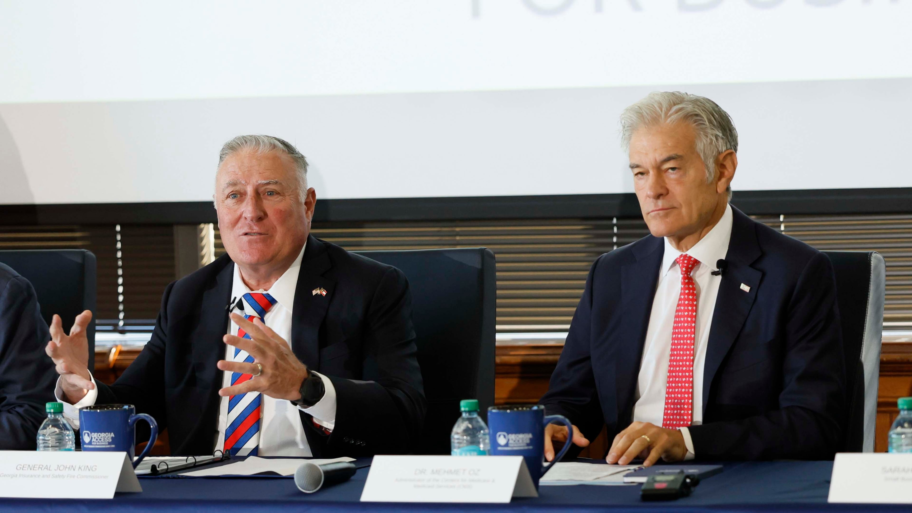 Georgia Insurance and Safety Fire Commissioner John King, left, and Medicare & Medicaid Services Administrator Dr. Mehmet Oz speak during roundtable with health leaders on Monday in Atlanta. (Miguel Martinez/AJC)