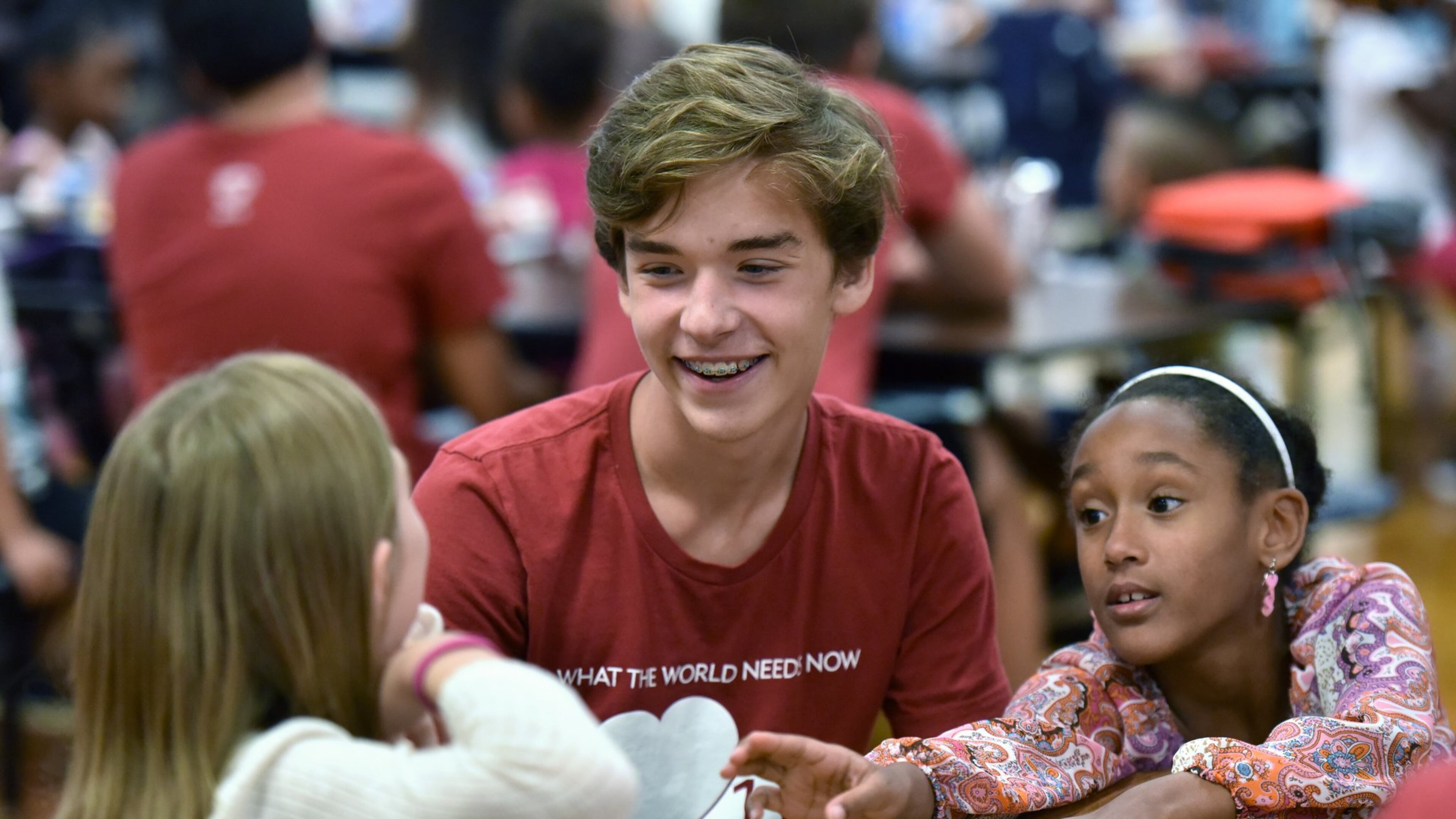 Nathan Jones, 17, interacts with elementary students at Compton Elementary School in Powder Springs on Sept. 20. HYOSUB SHIN / HSHIN@AJC.COM