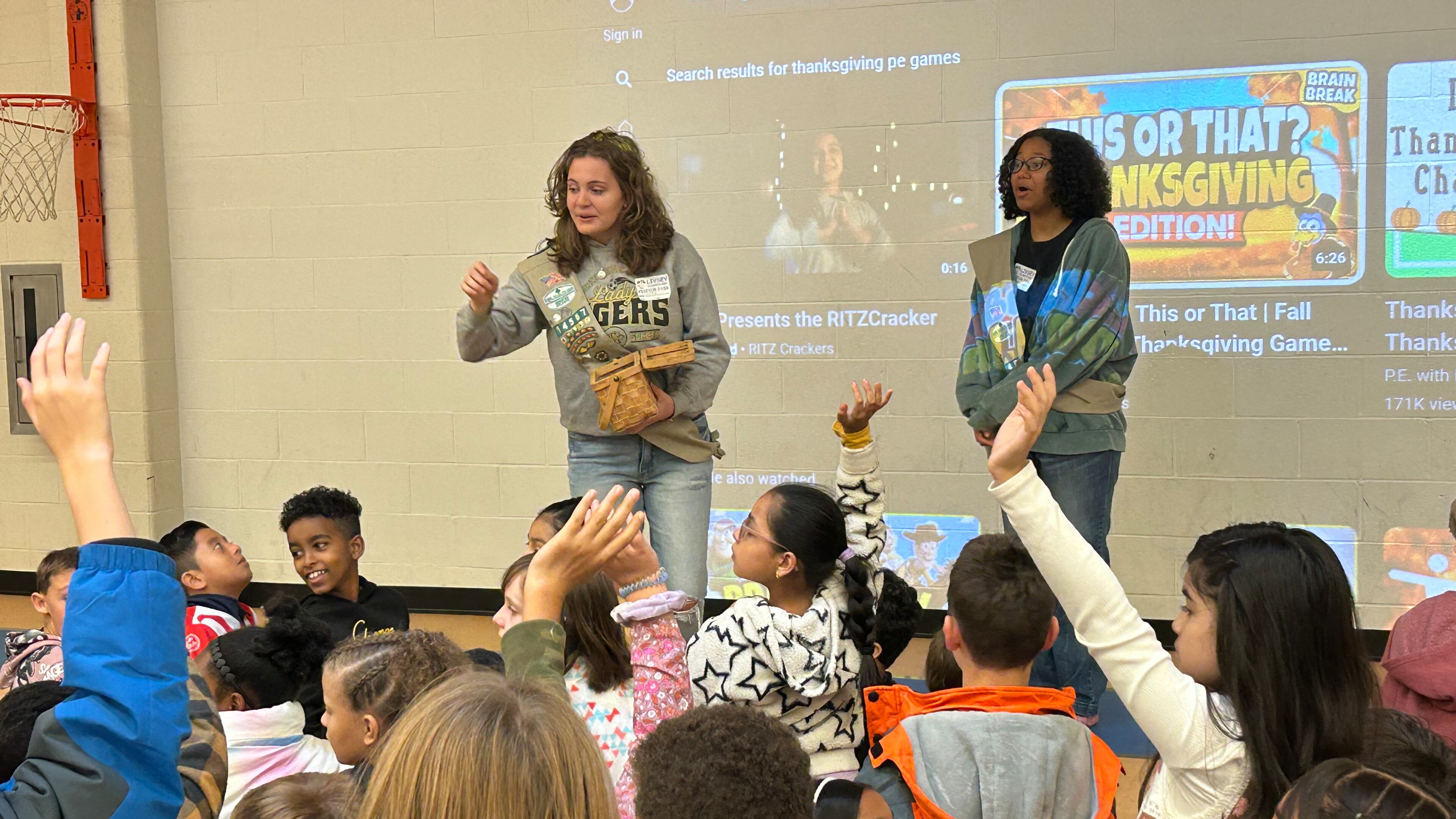 Lily Crick (left) and Gnouma Fofana talk about bullying with students at Livsey Elementary in Tucker.