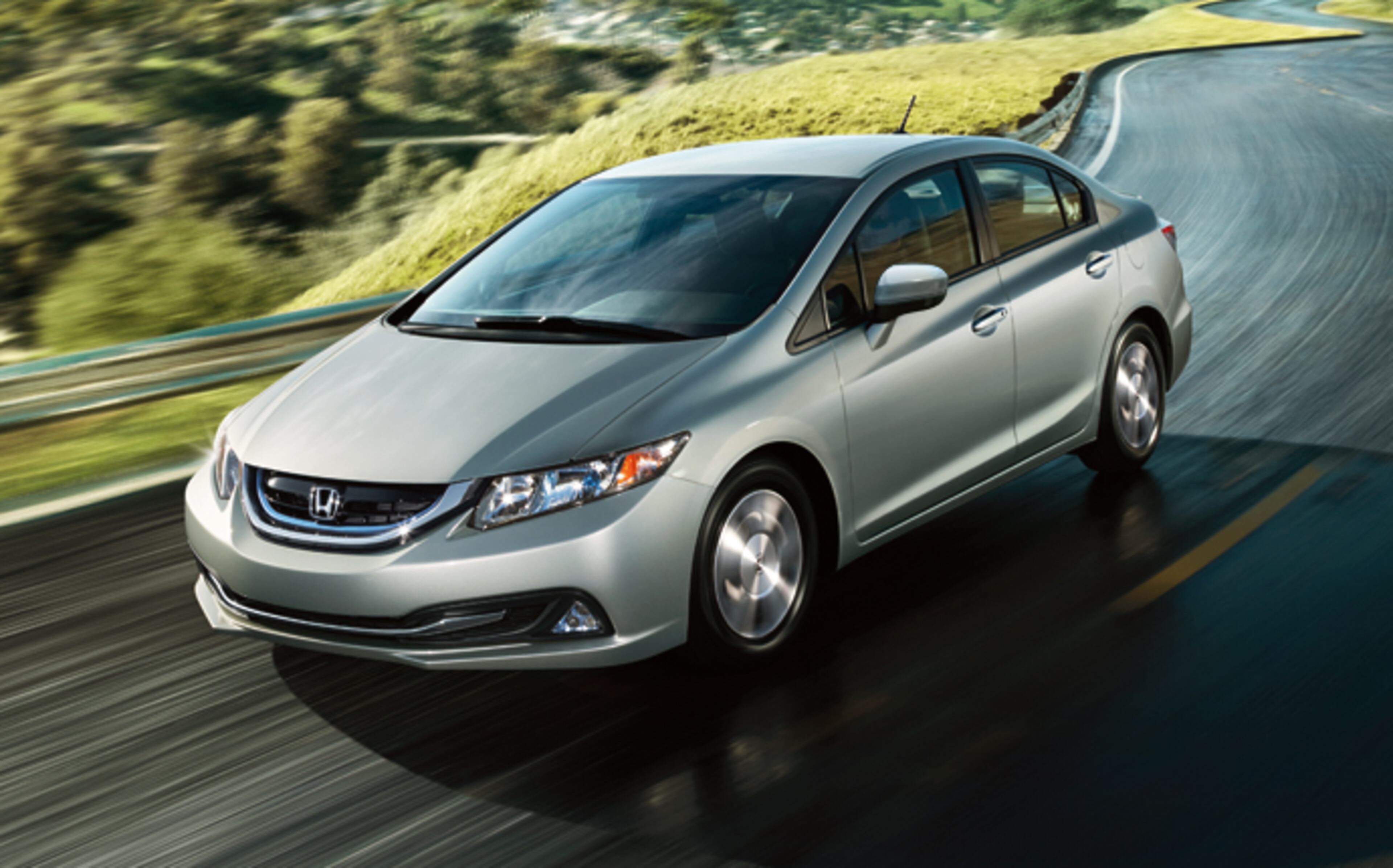 Updates for the 2014 model year helped push the compact Honda Civic Hybrid to 45 mpg in combined city and highway driving. The car retails around $25,000.