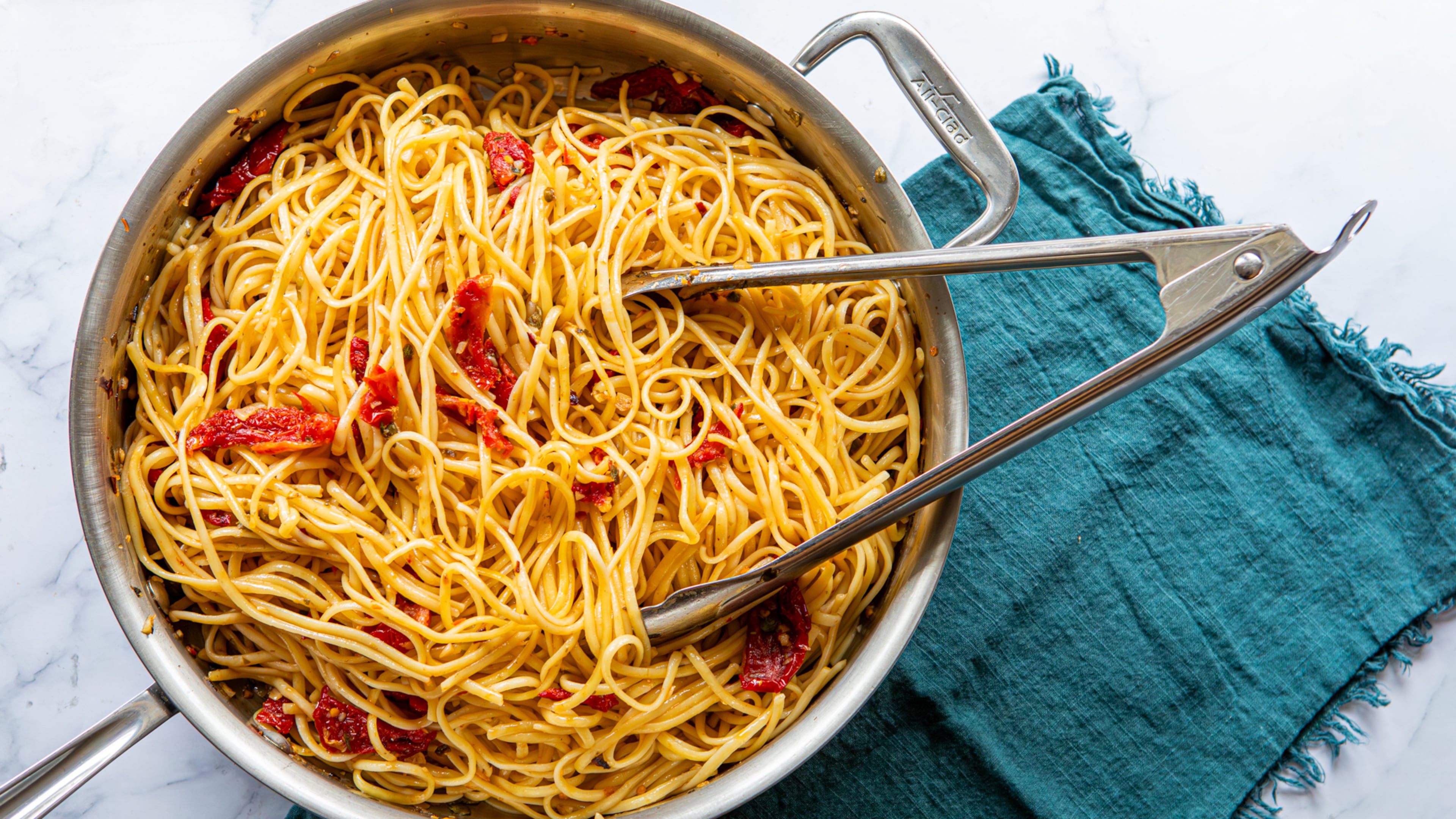 Spicy Sun-Dried Tomato Pasta includes garlic, capers and red pepper flakes. (Aaliyah Man for the AJC/food styling by Kate Williams)