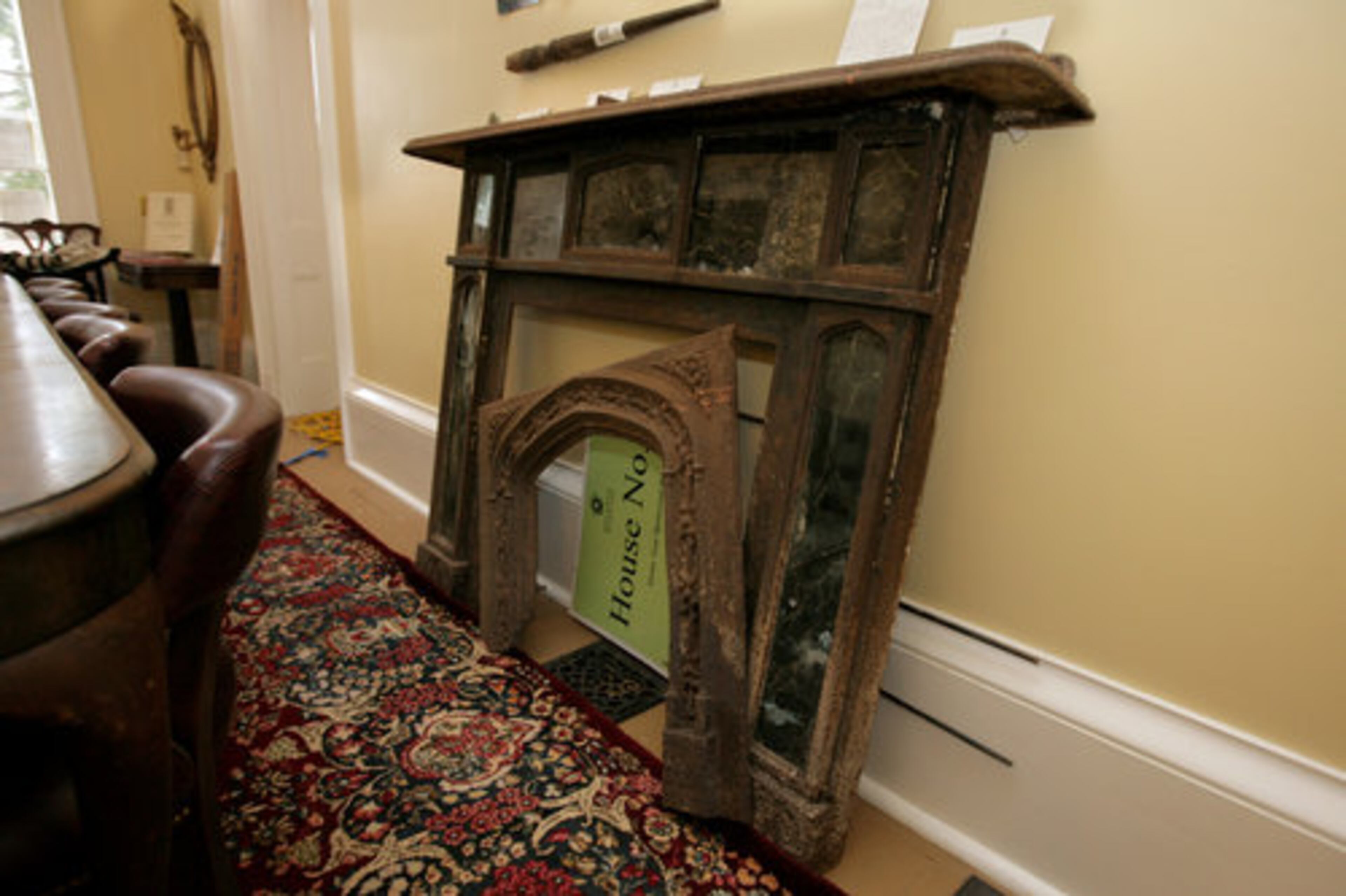 This mantelpiece was excavated from the mansion's yard. Some relics found on the site are from past attempts to renovate, but some, such as this mantelpiece, have been identified as original to the building.