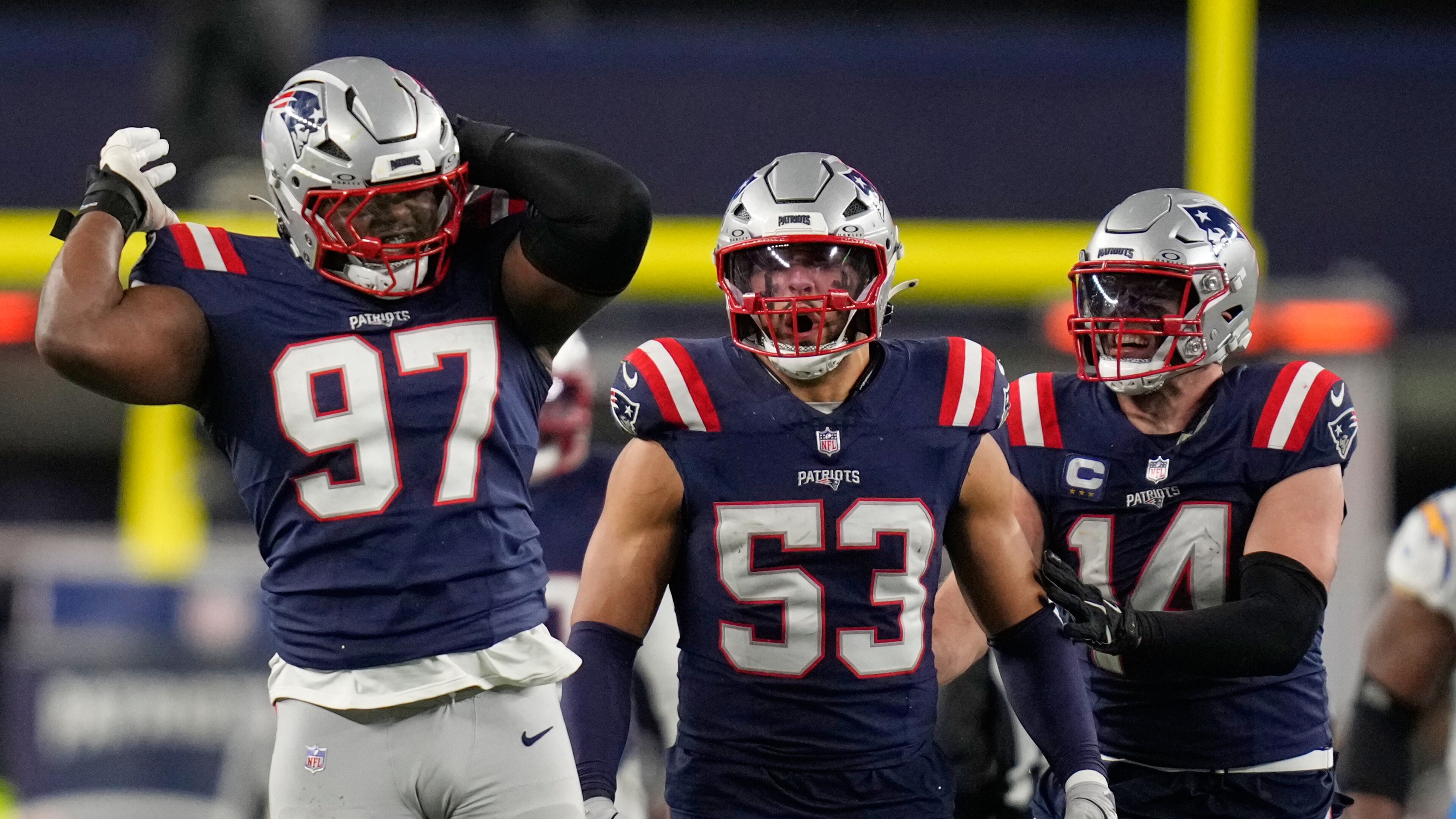 New England Patriots defensive end Milton Williams (97), linebacker Christian Elliss (53) and linebacker Robert Spillane (14) celebrate Williams' sack of Los Angeles Chargers quarterback Justin Herbert (10) in the second half of an NFL wild-card playoff football game in Foxborough, Mass., Sunday, Jan. 11, 2026. (AP Photo/Charles Krupa)