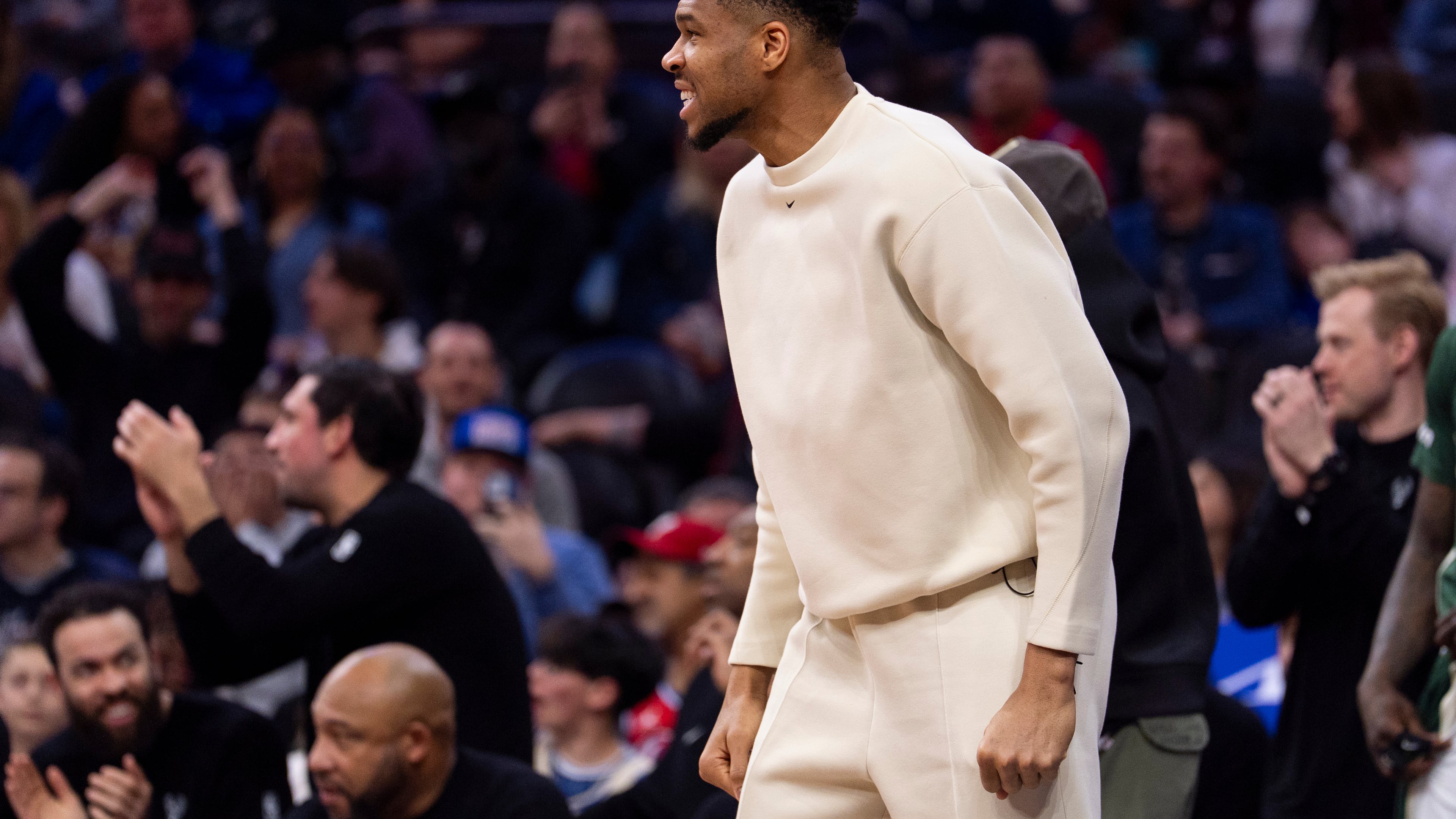 Milwaukee Bucks power forward Giannis Antetokounmpo, center, reacts from the sideline during the first half of an NBA basketball game against the Philadelphia 76ers, Sunday, April 12, 2026, in Philadelphia. (AP Photo/Chris Szagola)