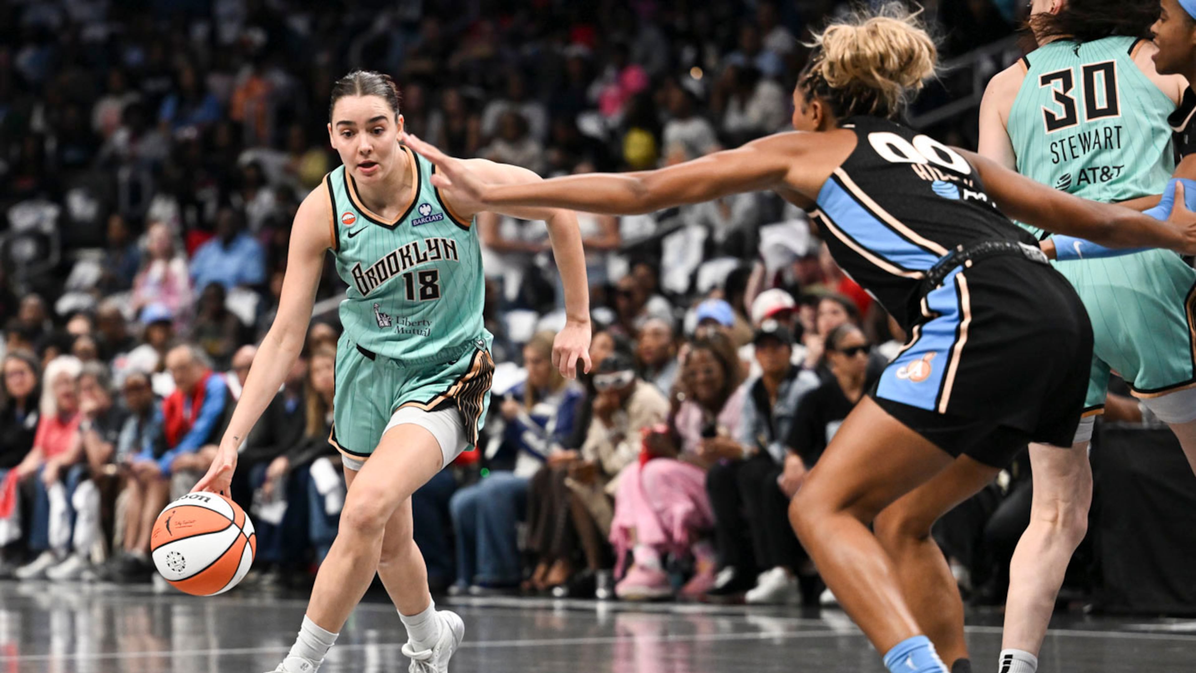 New York guard Pauline Astier (18) drives to the basket against Atlanta forward Naz Hillmon (00) during the first half in Game 2 of the WNBA basketball semifinals, Wednesday, Oct. 7, 2026, in Atlanta. (AP Photo/Daniel Varnado)