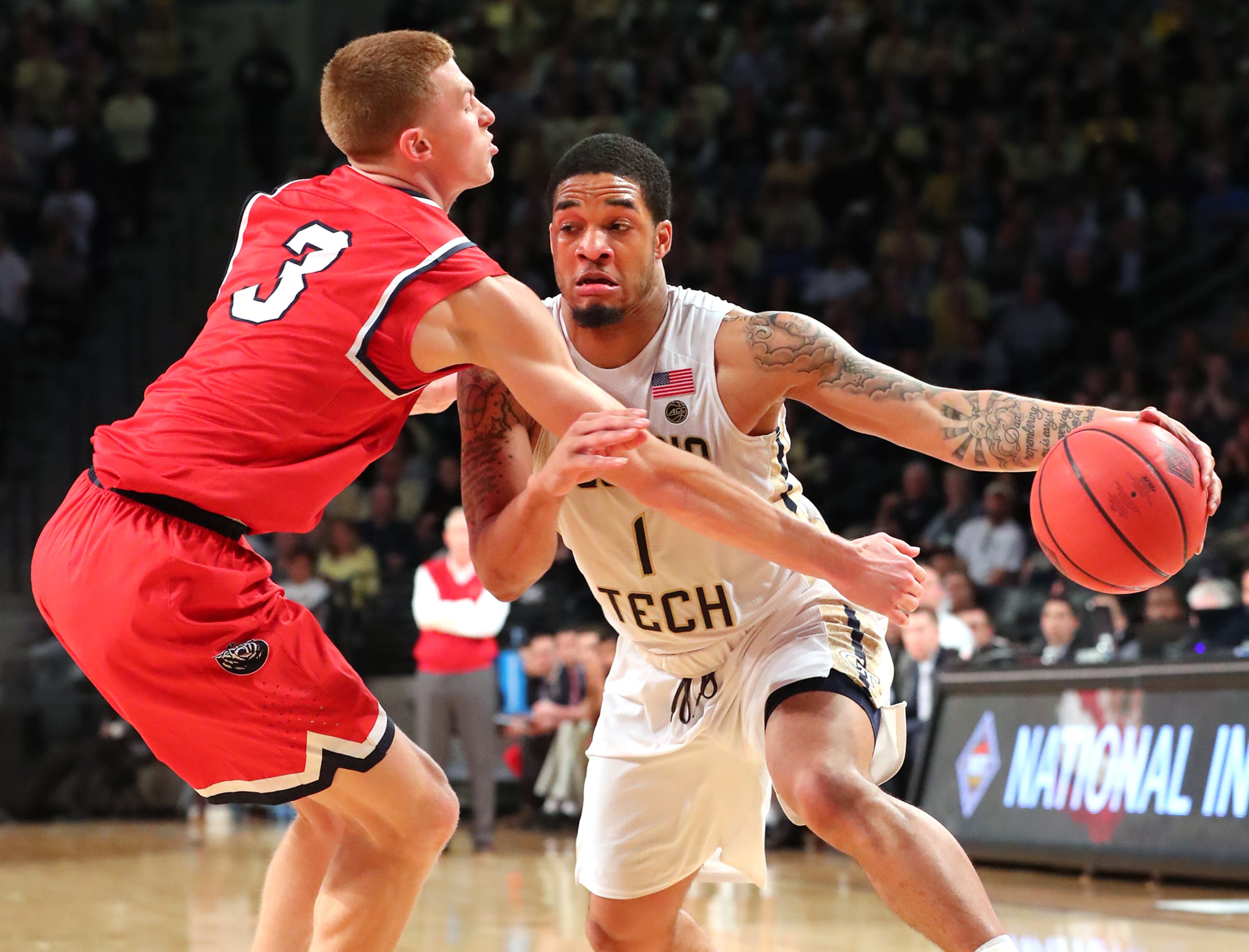 Tadric Jackson drives past Belmont guard Dylan Windler during Sunday's game.
