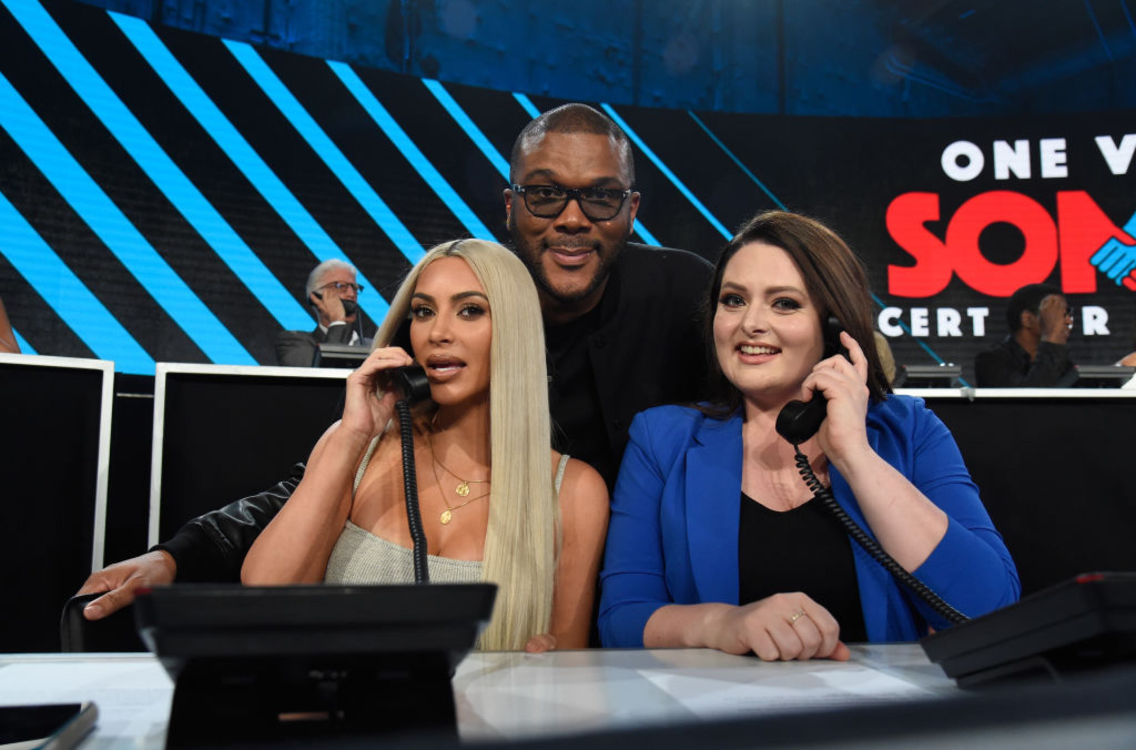 LOS ANGELES, CA - OCTOBER 14: In this handout photo provided by One Voice: Somos Live!, Kim Kardashian and actors Tyler Perry and Lauren Ash participate in the phone bank onstage during "One Voice: Somos Live! A Concert For Disaster Relief" at the Universal Studios Lot on October 14, 2017 in Los Angeles, California. (Photo by Kevin Mazur/One Voice: Somos Live!/Getty Images)