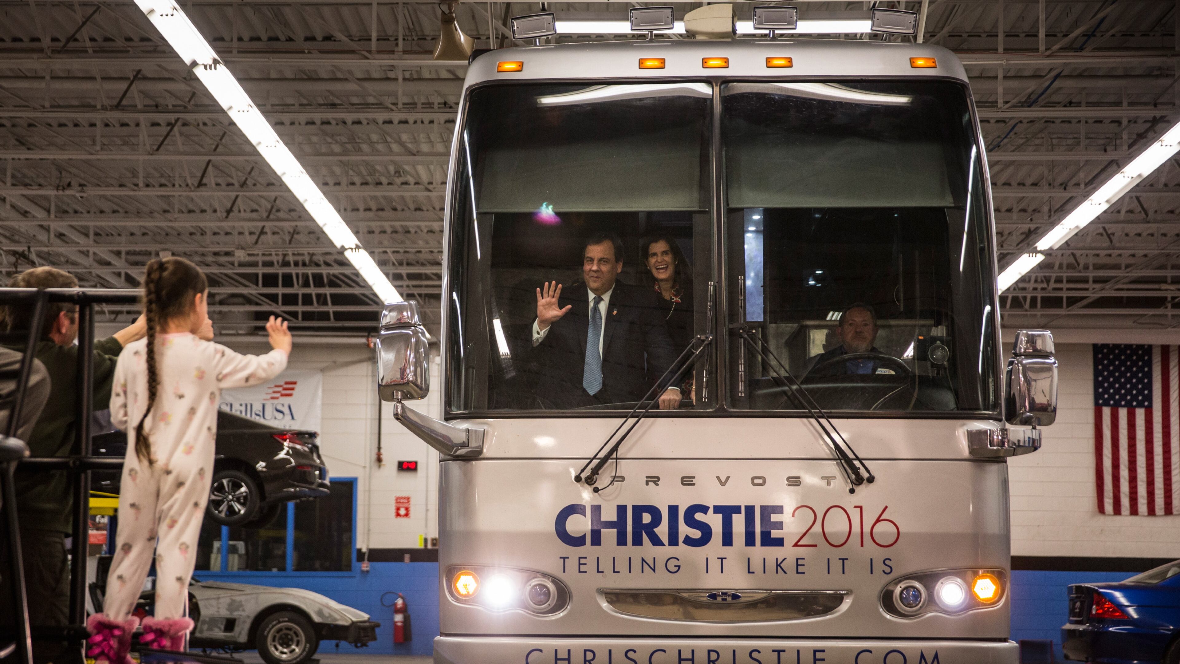 Republican presidential hopeful and New Jersey Gov. Chris Christie arrives at a campaign event by having his bus driven into a garage at Nashua Community College on Monday in Nashua, N.H. Andrew Burton/Getty Images
