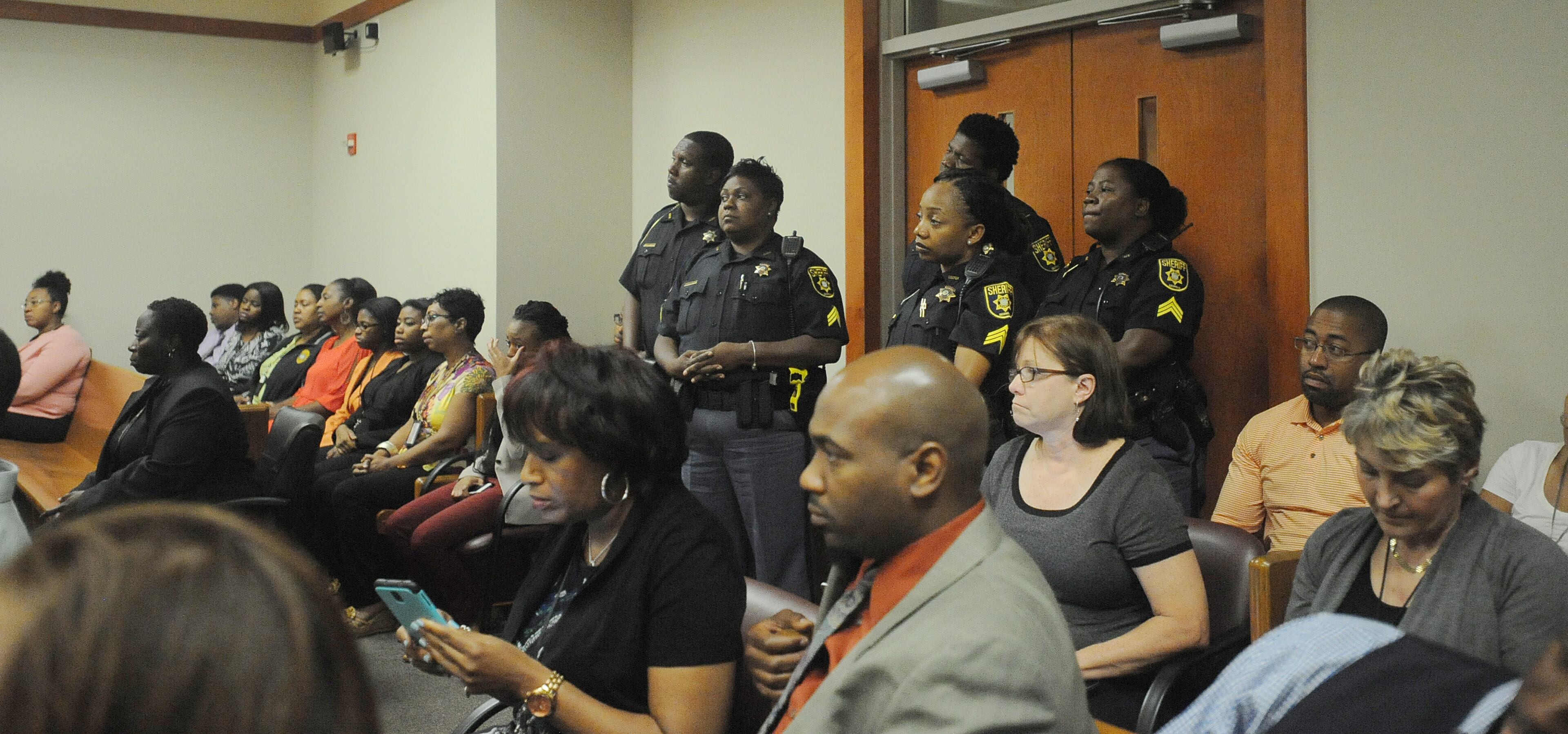 Extra DeKalb County deputies man security in the packed courtroom, as DeKalb CEO Burrell Ellis was found guilty on 4 counts in his retrial before Superior Court Judge Courtney Johnson Wednesday, July 1, 2015.