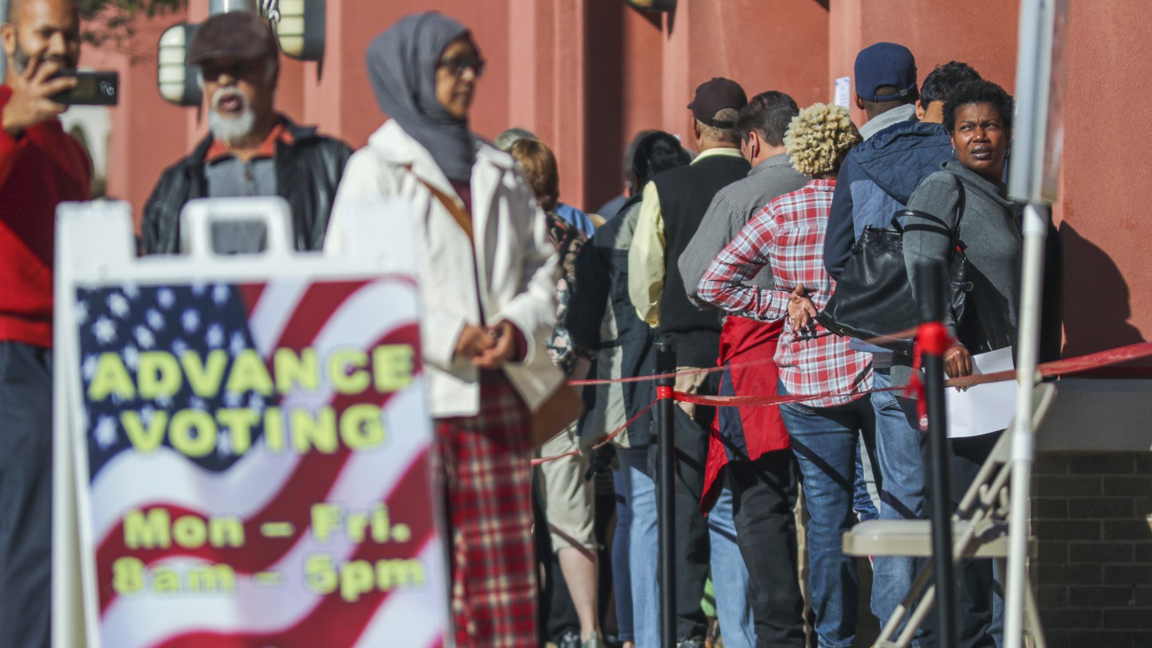 Voters wait in lengthy lines in October 2018 at the Cobb County West Park Government Center in Marietta. JOHN SPINK/JSPINK@AJC.COM