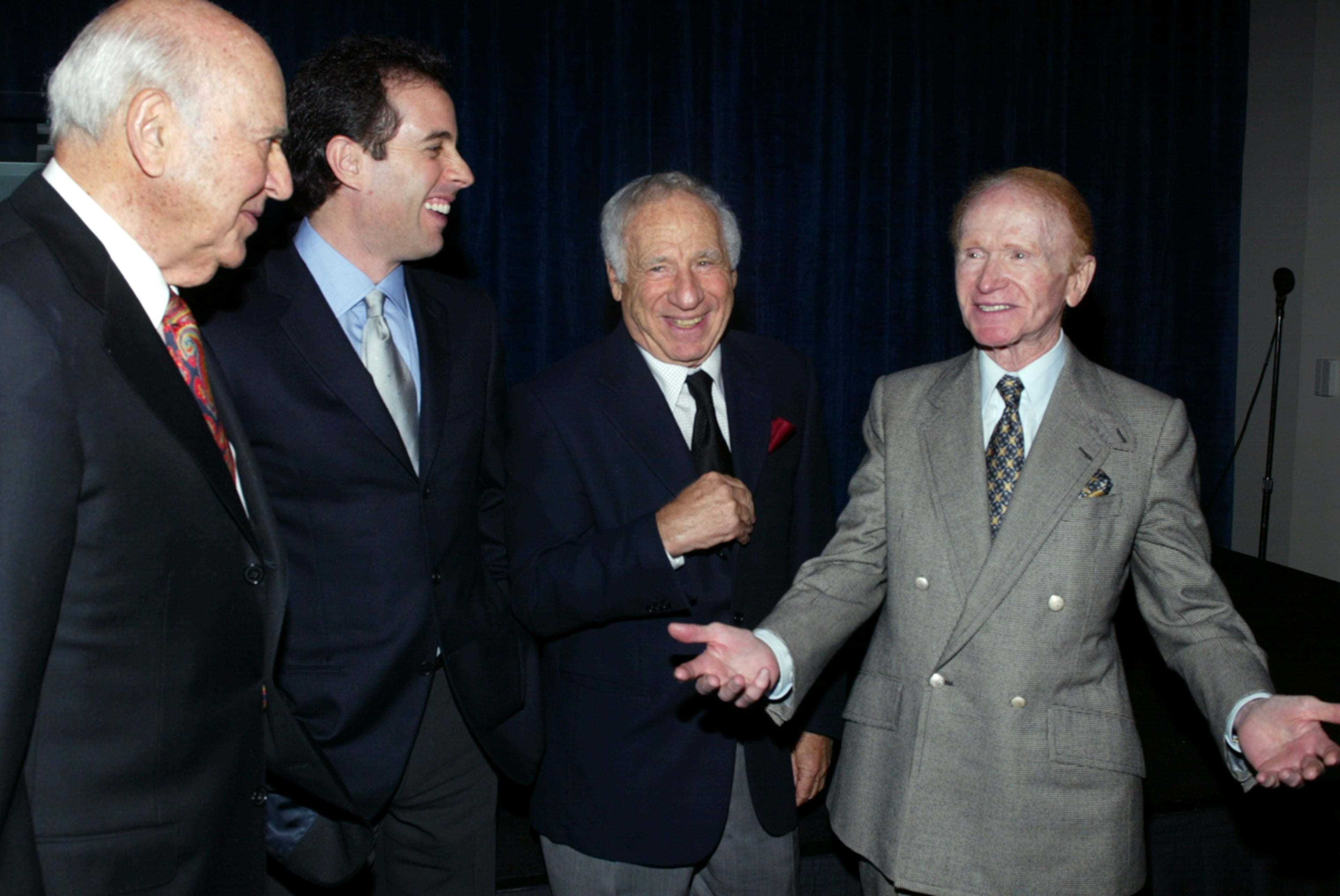 (L to R) Comedians Carl Reiner, Jerry Seinfeld, Mel Brooks and Red Buttons attend the "A Night of Comedy" fund raiser to benefit the "I am Your Child Foundation" at the Annex of Hollywood and Highland on April 9, 2003 in Hollywood, California. The funds raised by the benefit will support the foundation's work on behalf of young children across the United States. (Photo by Frederick M. Brown/Getty Images)