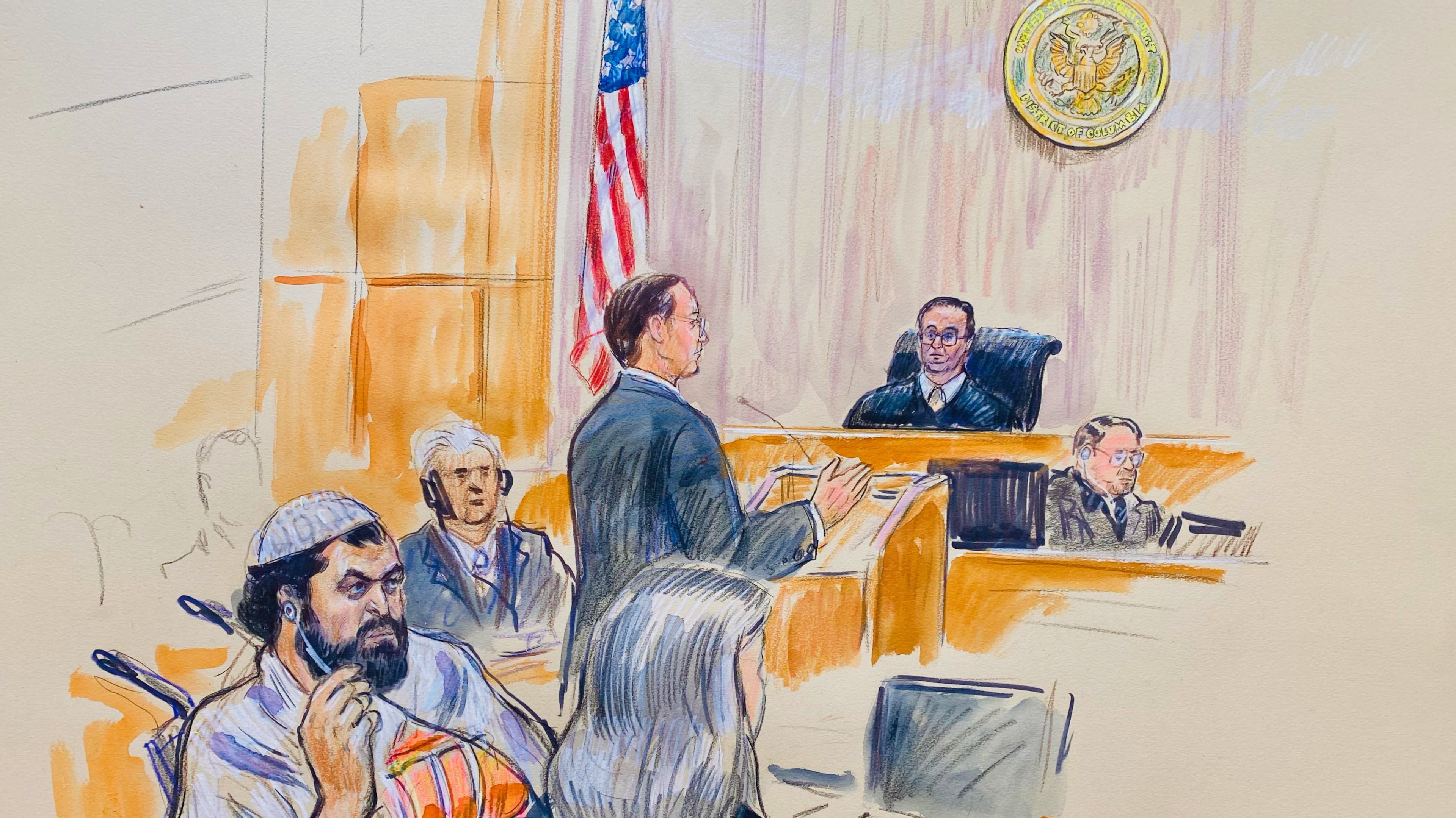 This courtroom sketch depicts Rahmanullah Lakanwal, 29, seated left, with defense attorney Michelle Peterson, seated foreground, before U.S. District Judge Amit Mehta, Feb. 4, 2025 at Federal Court in Washington, as Assistant U.S. Attorney Christopher Tortorice speaks at the podium. (Dana Verkouteren via AP)