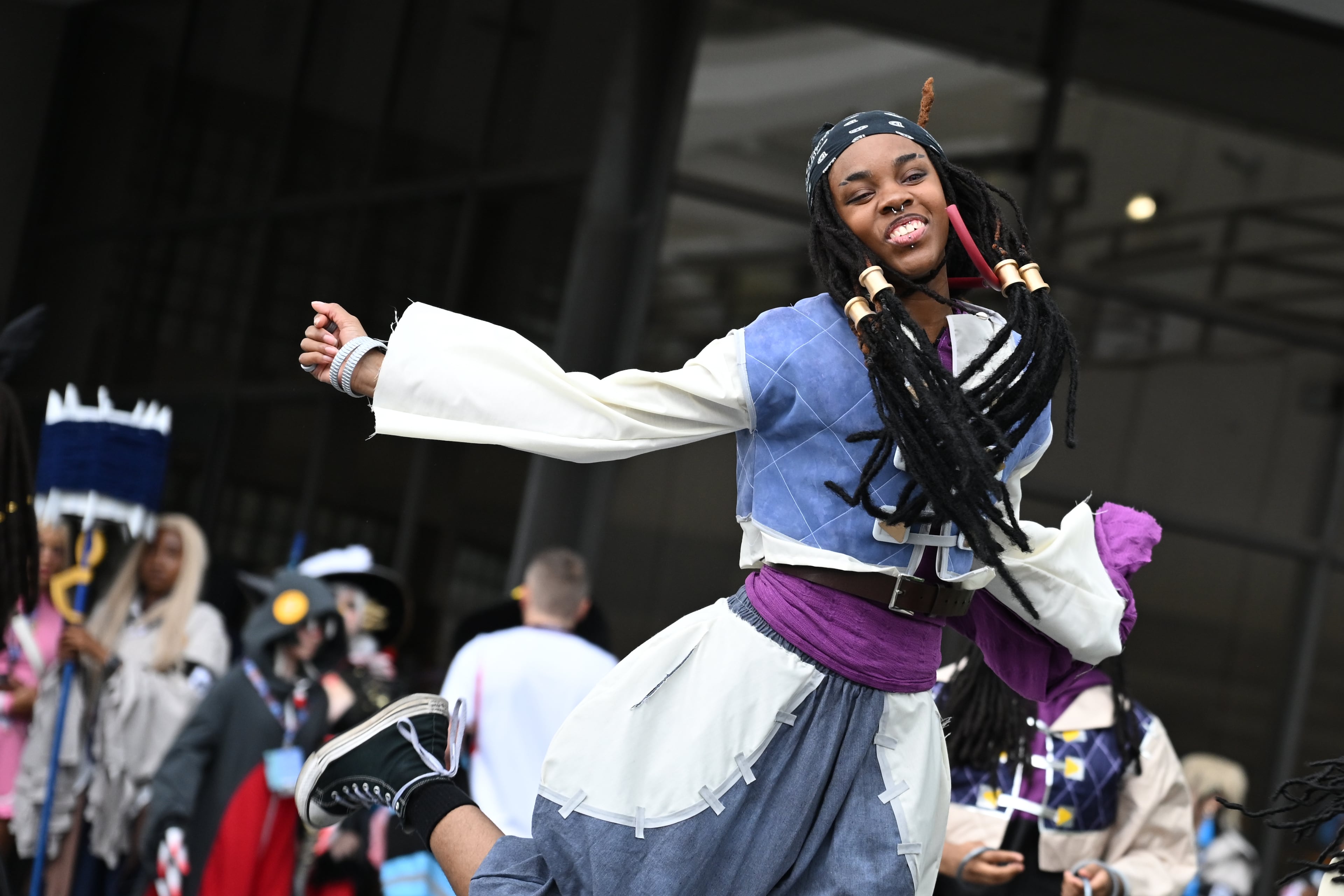 An attendee dances for a photoshoot during MomoCon at the Georgia World Congress Center in Atlanta on Friday, May 22, 2026. (Tyler Sun for the AJC)